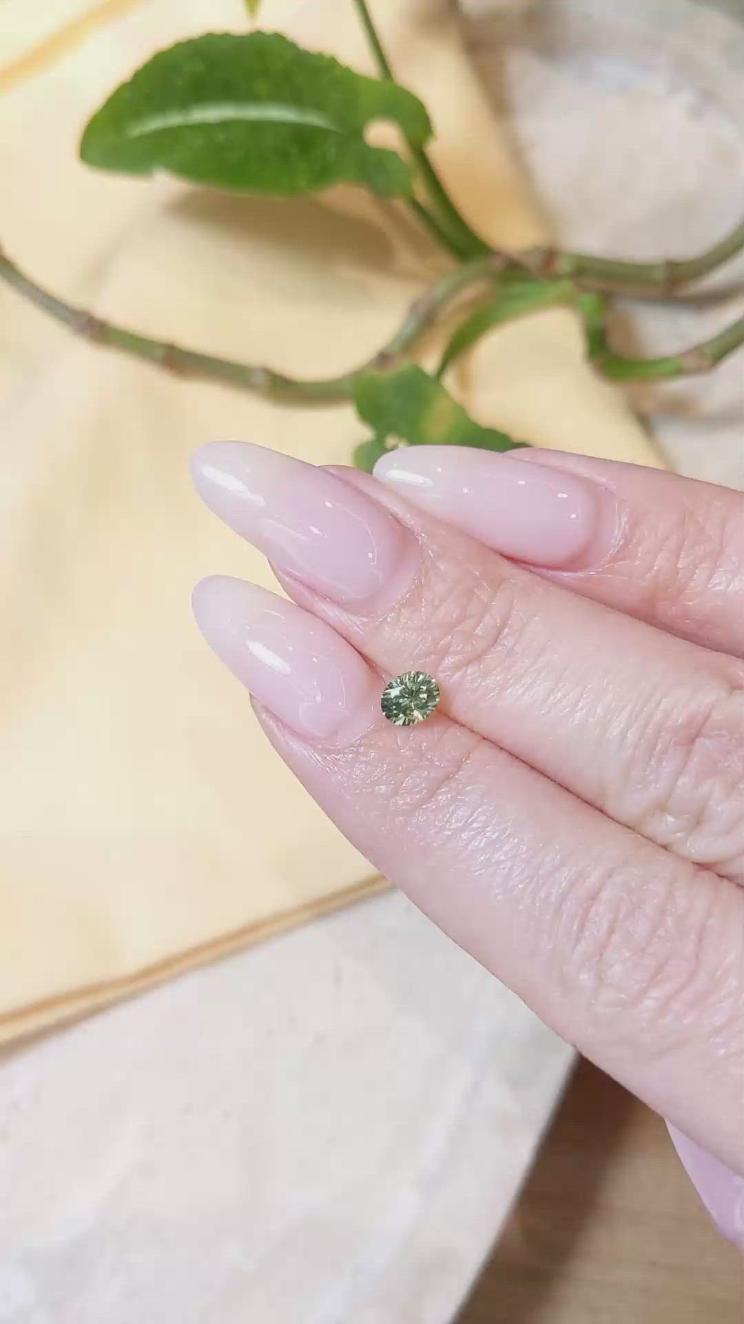 0.64 Ct. Yellowish Green Sapphire from Montana Size Video