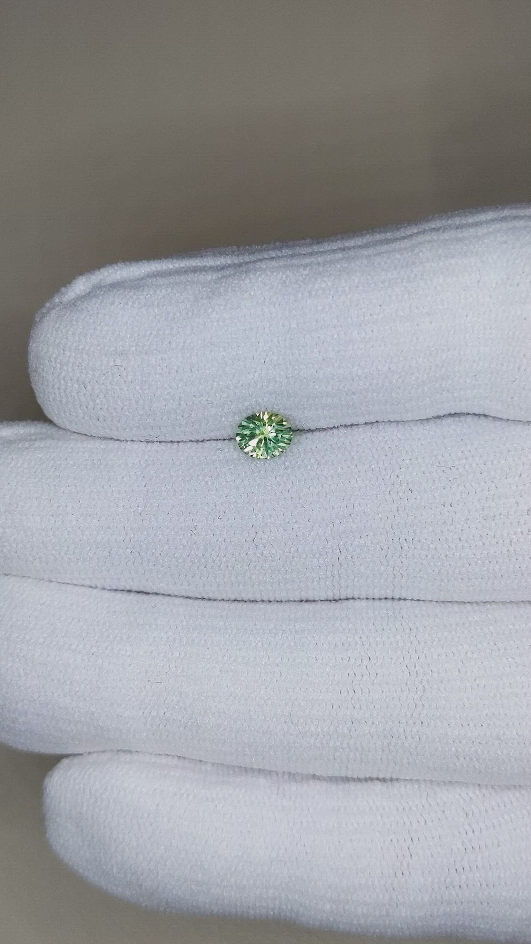 0.64 Ct. Yellowish Green Sapphire from Montana Size Video