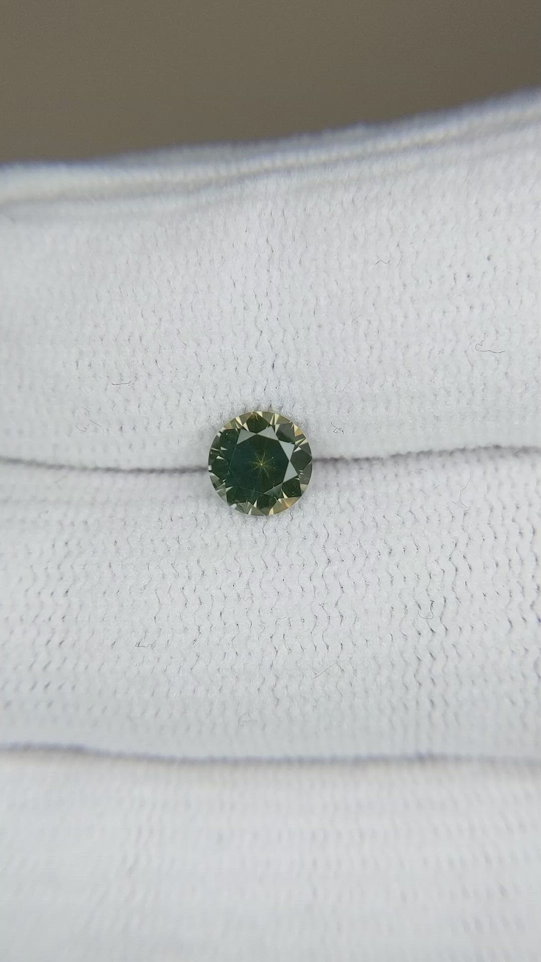 0.84 Ct. Yellowish Green Sapphire from Montana Size Video