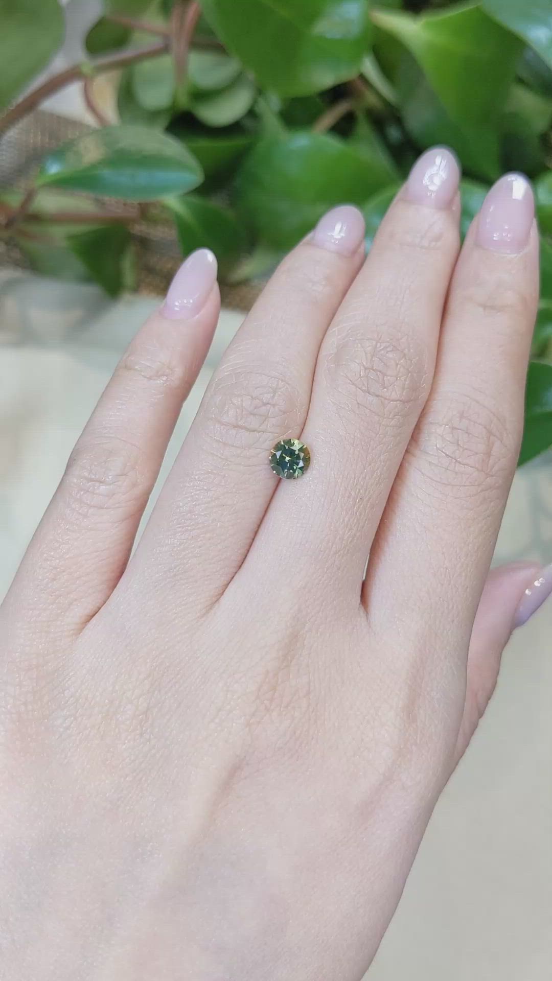 0.84 Ct. Yellowish Green Sapphire from Montana Size Video