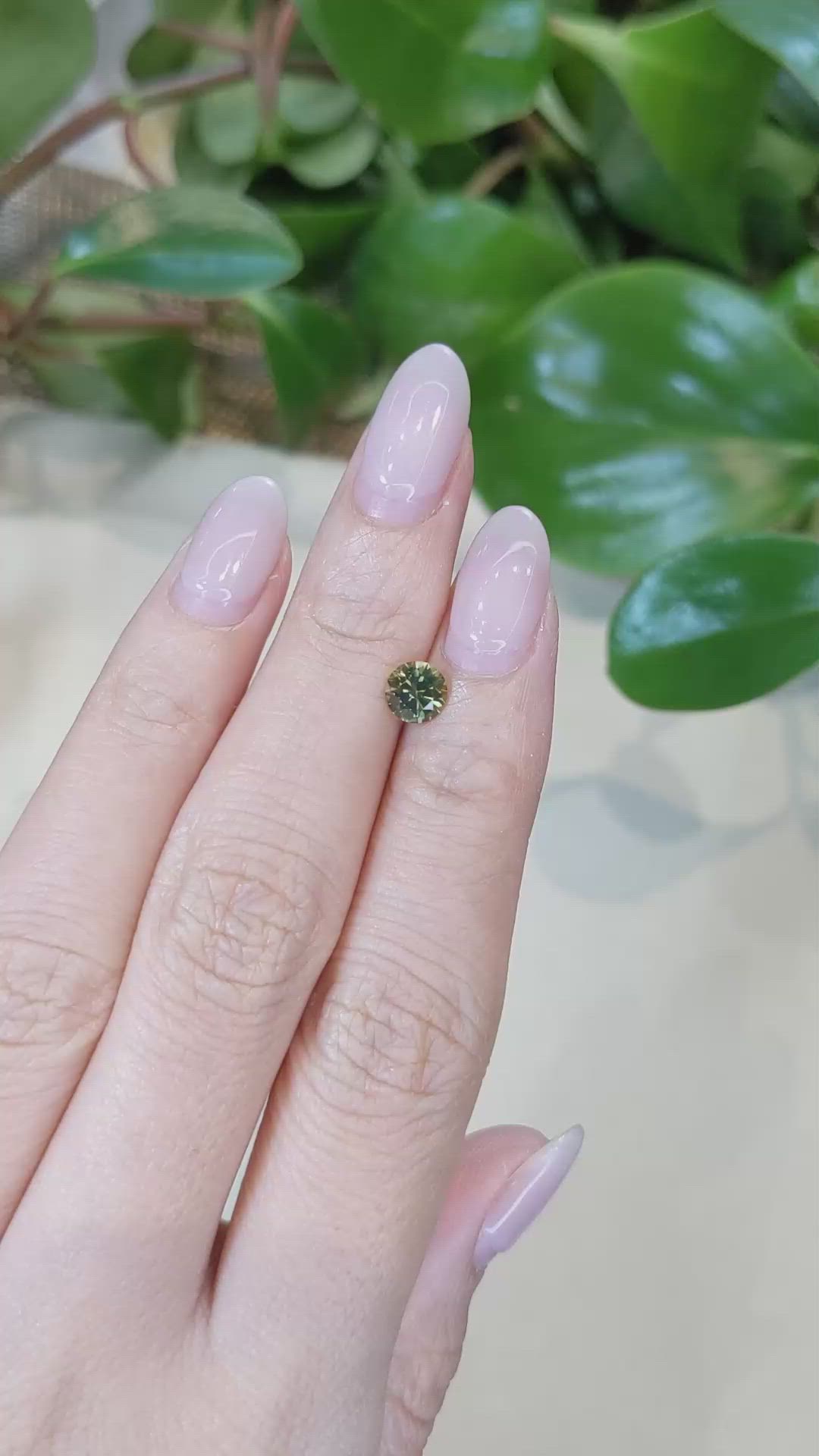 0.84 Ct. Yellowish Green Sapphire from Montana Size Video