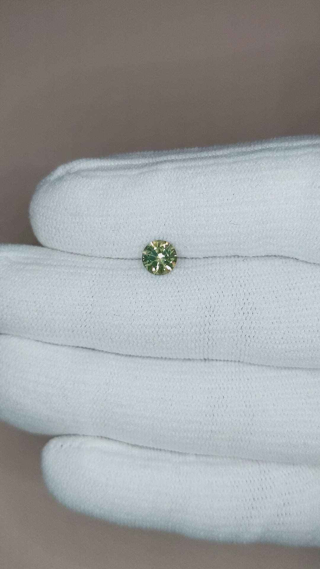 0.84 Ct. Yellowish Green Sapphire from Montana Size Video