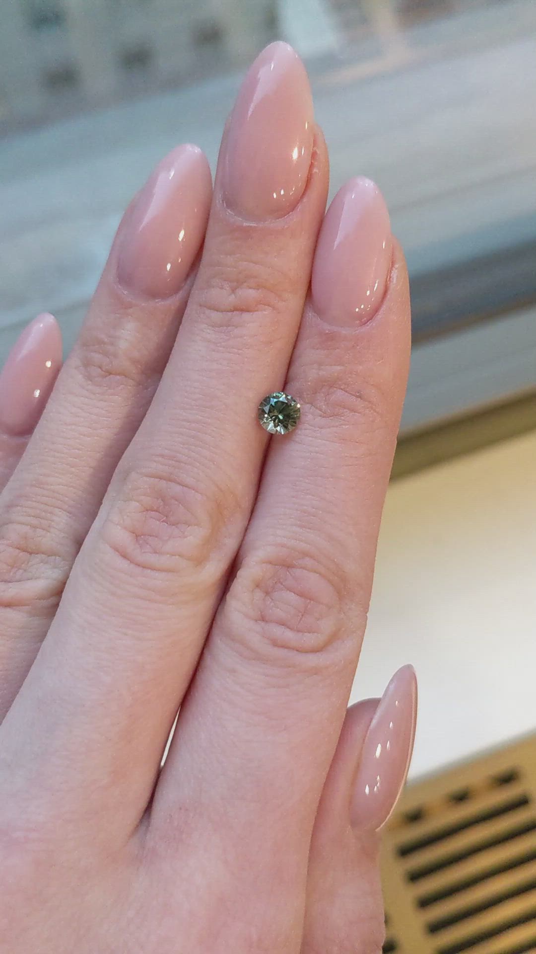 0.77 Ct. Yellowish Green Sapphire from Montana Size Video