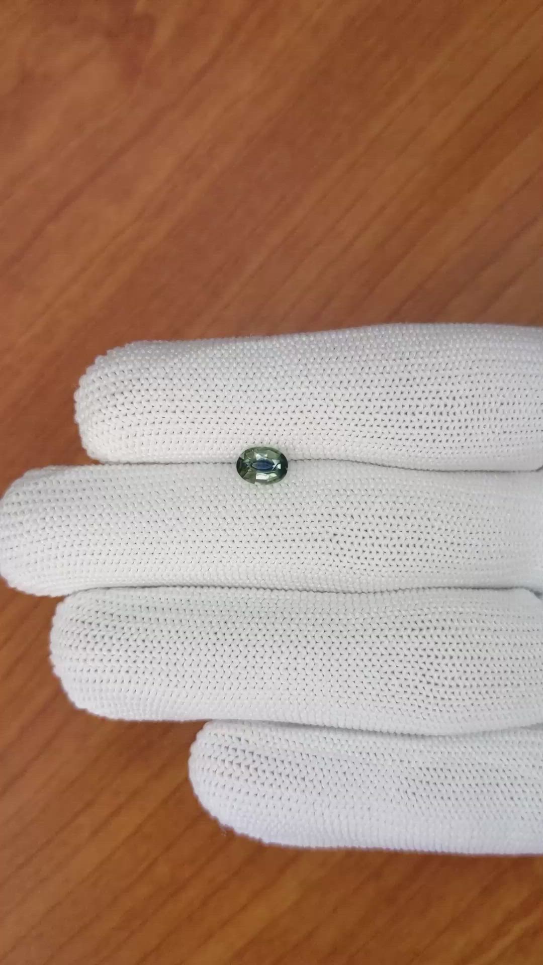0.71 Ct. Bluish Green Sapphire from Madagascar Size Video