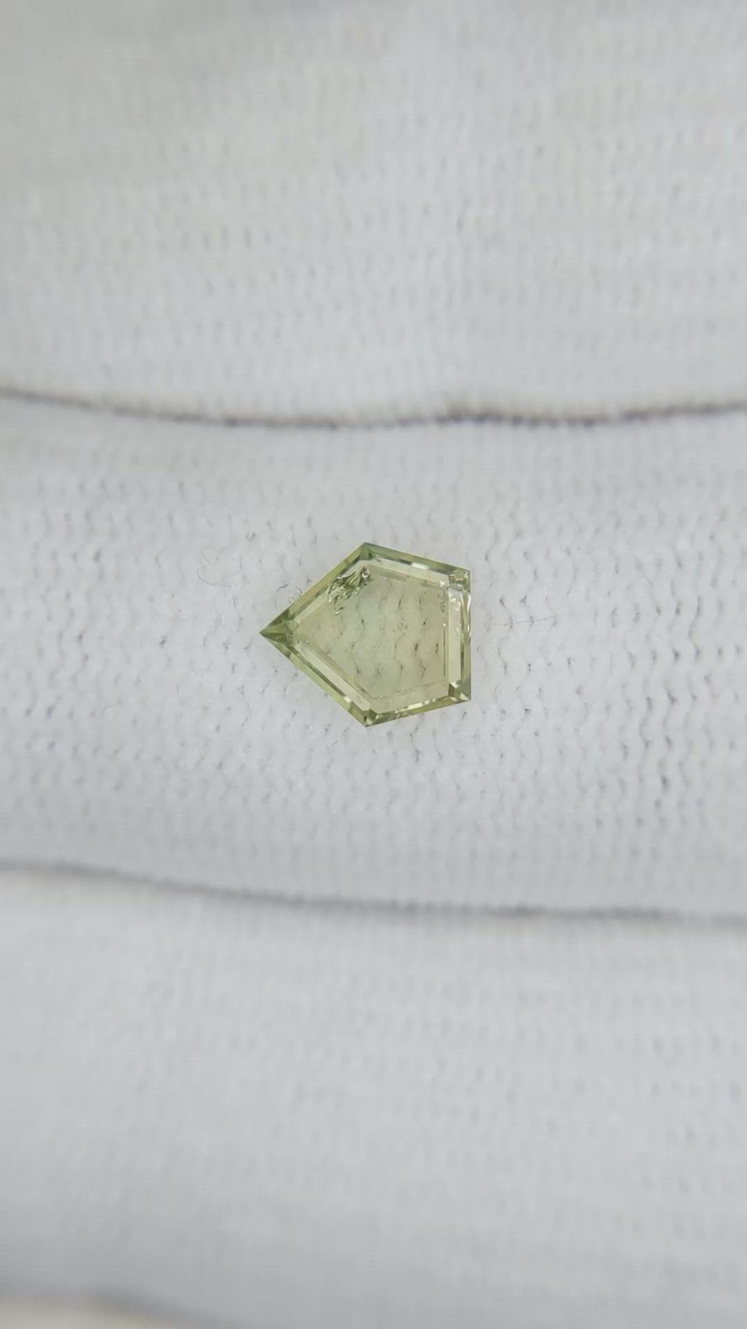 0.77 Ct. Yellowish Green Sapphire from Montana Size Video