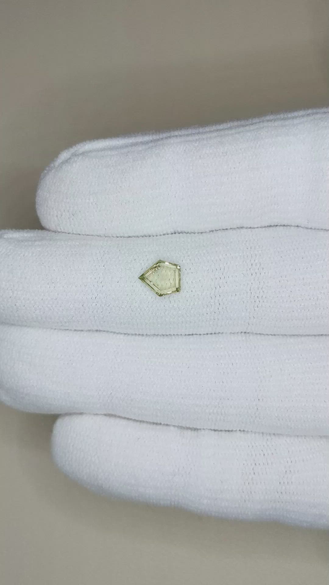 0.77 Ct. Yellowish Green Sapphire from Montana Size Video