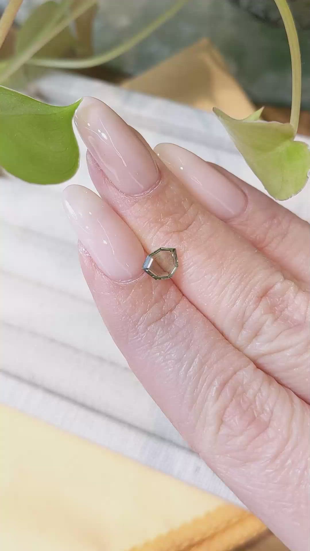 0.90 Ct. Yellowish Green Sapphire from Montana Size Video