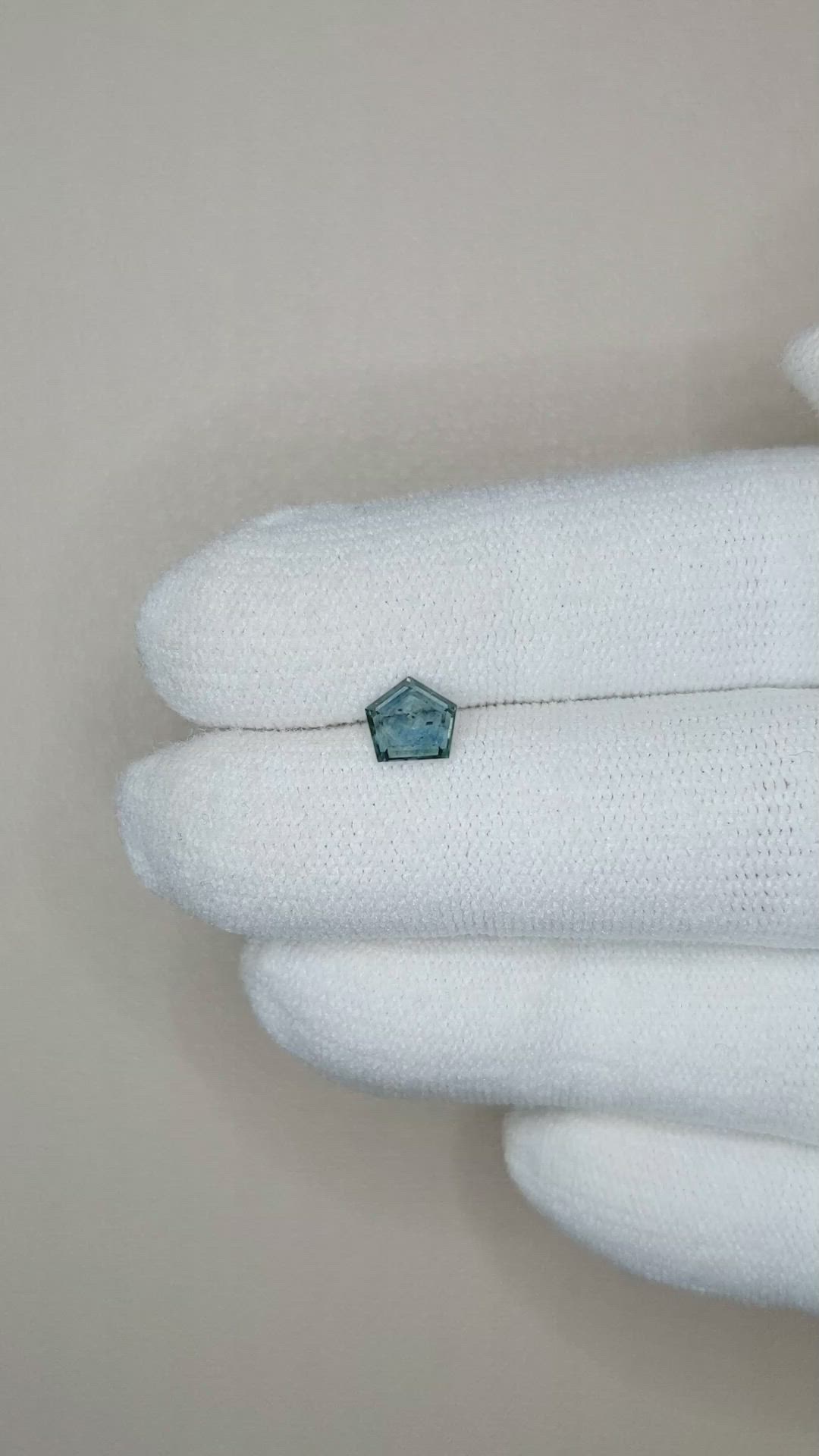 0.66 Ct. Bluish Green Sapphire from Montana Size Video