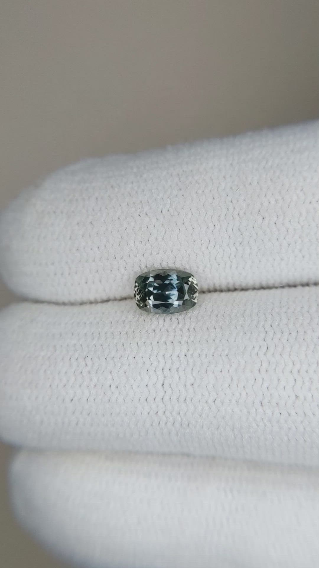 0.64 Ct. Brownish Green Sapphire from Montana Size Video