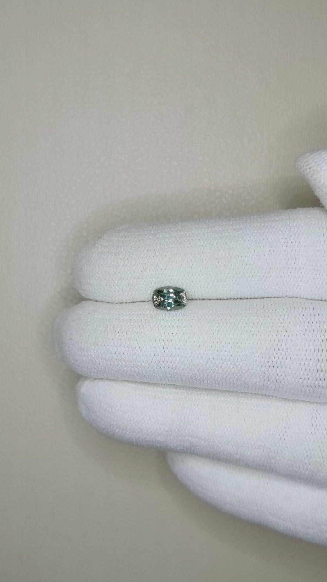 0.64 Ct. Brownish Green Sapphire from Montana Size Video