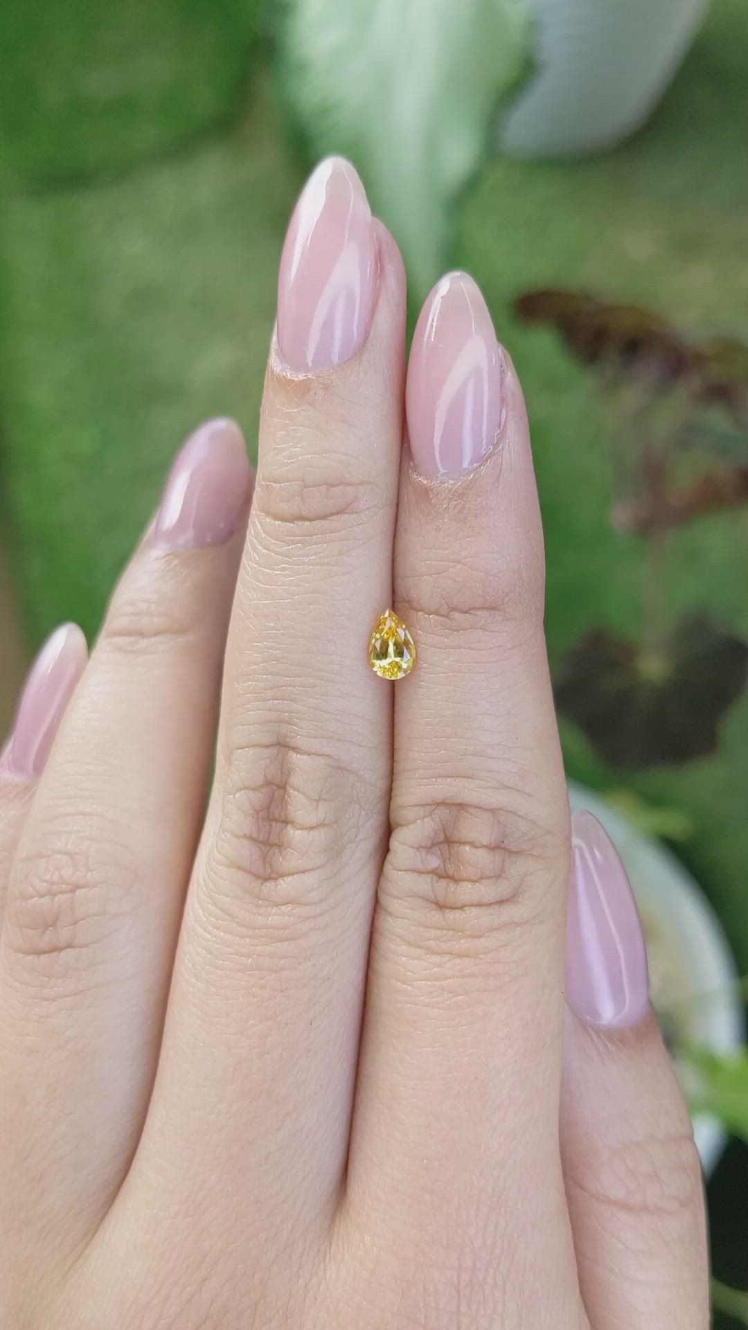 0.46 Ct. Orangish Yellow Sapphire from Ceylon (Sri Lanka) Size Video