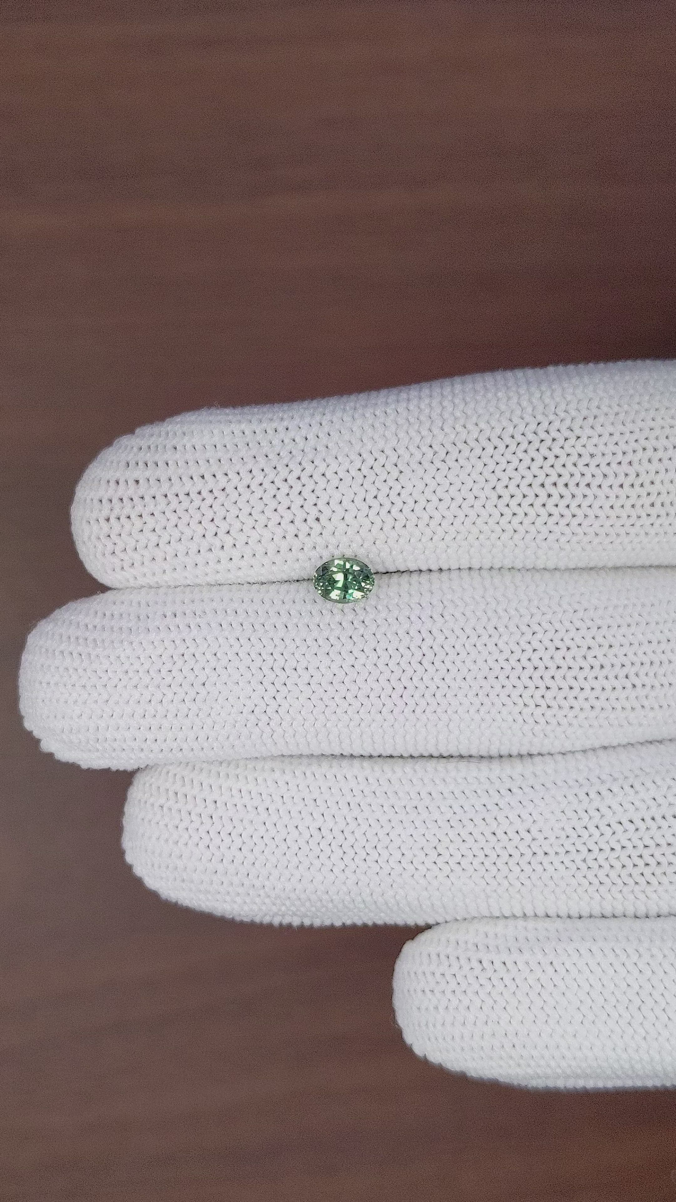 0.78 Ct. Bluish Green Sapphire from Tanzania Size Video