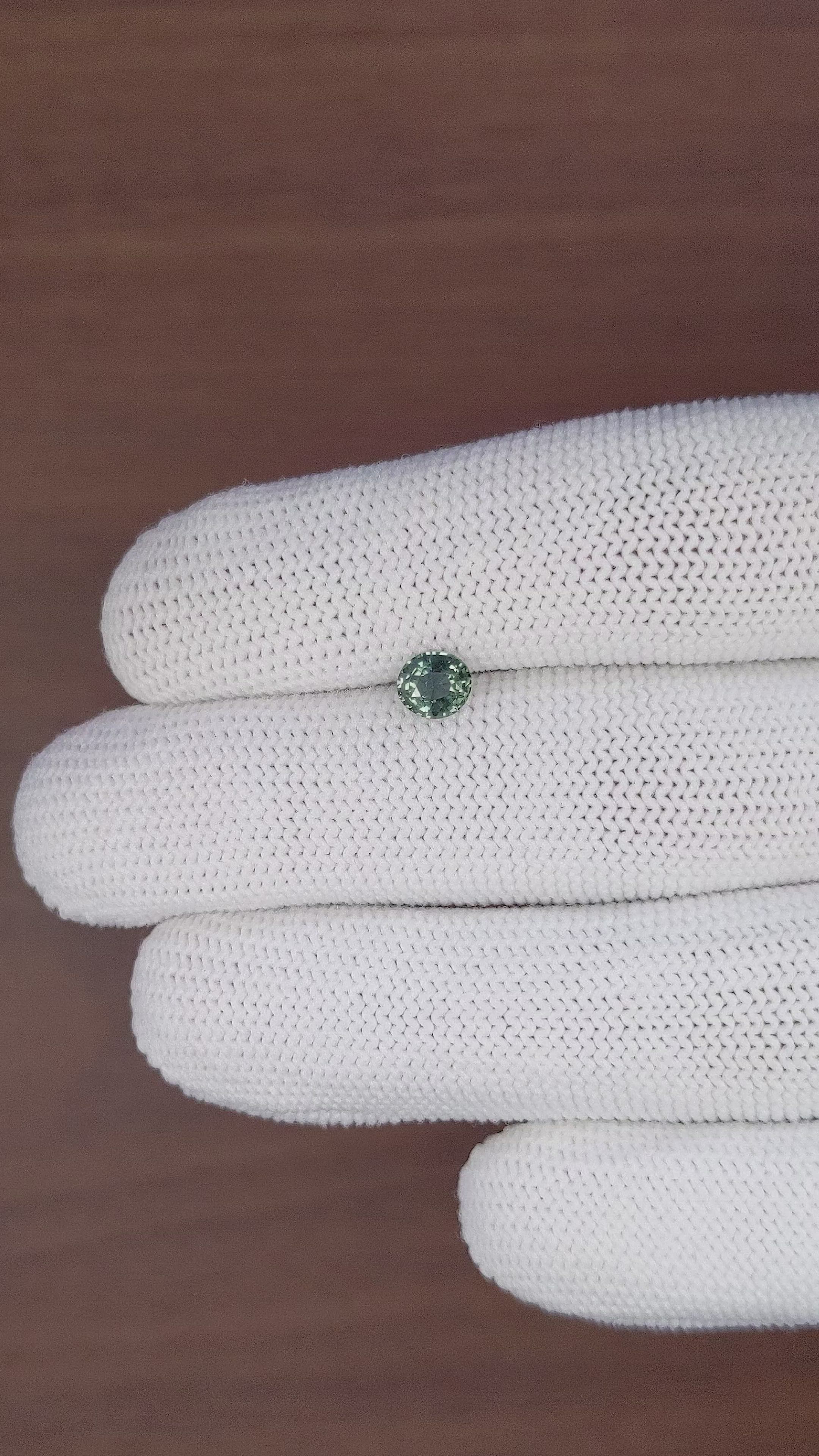 0.79 Ct. Bluish Green Sapphire from Tanzania Size Video
