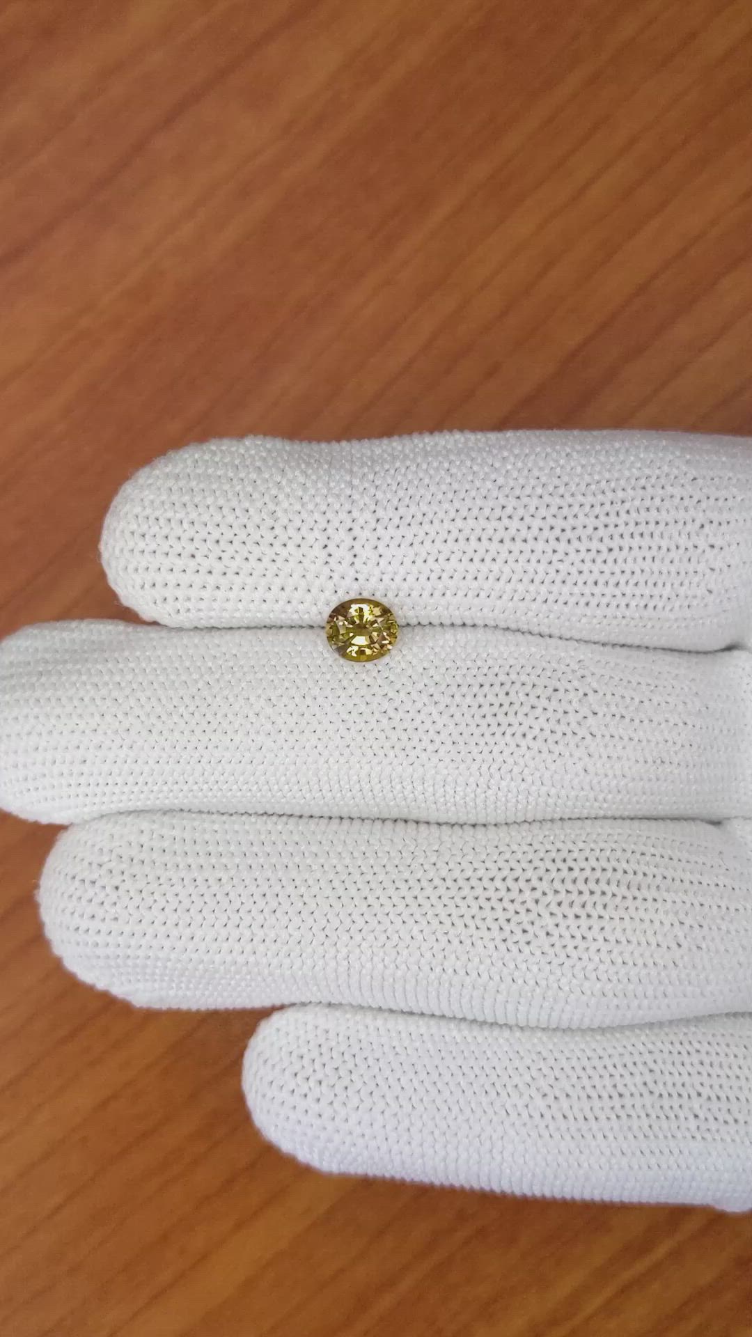 0.89 Ct. Yellowish Brown Sapphire from Madagascar Size Video