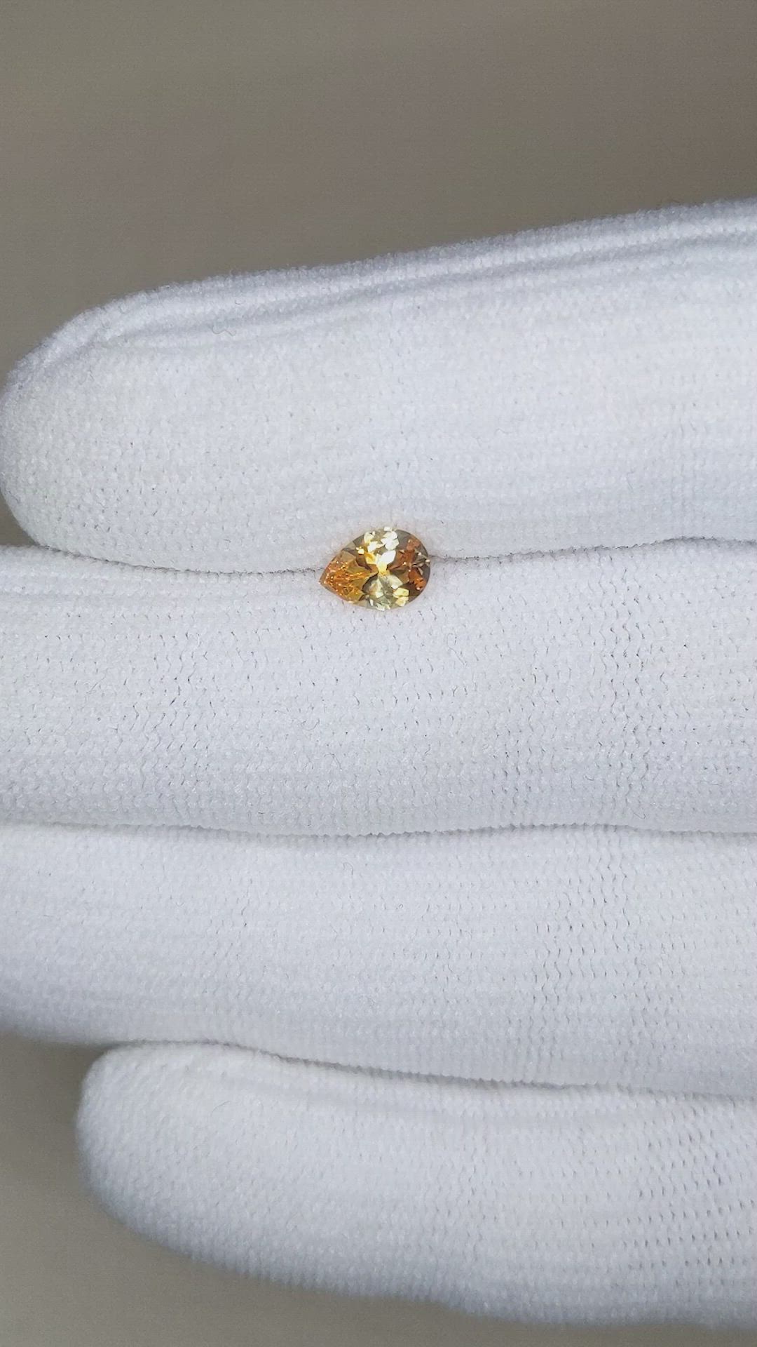 0.62 Ct. Orangish Yellow Sapphire from Montana Size Video