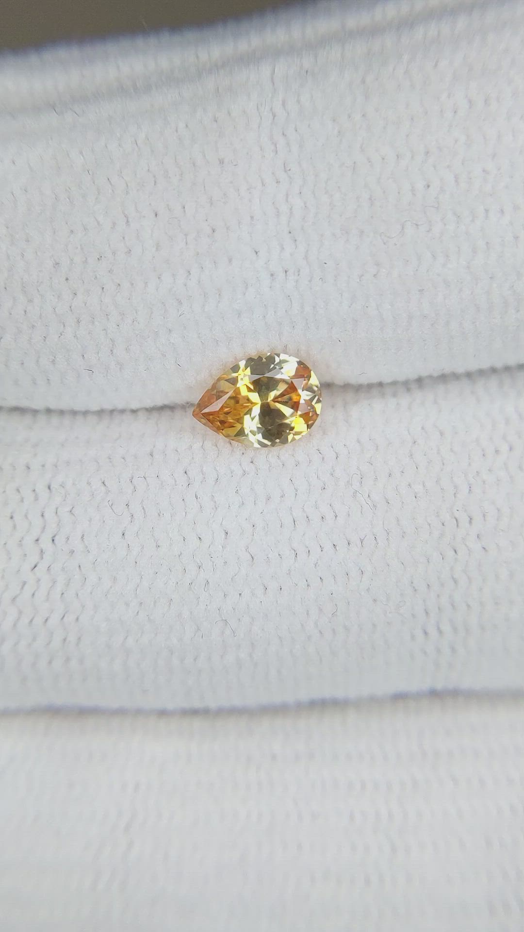 0.62 Ct. Orangish Yellow Sapphire from Montana Size Video