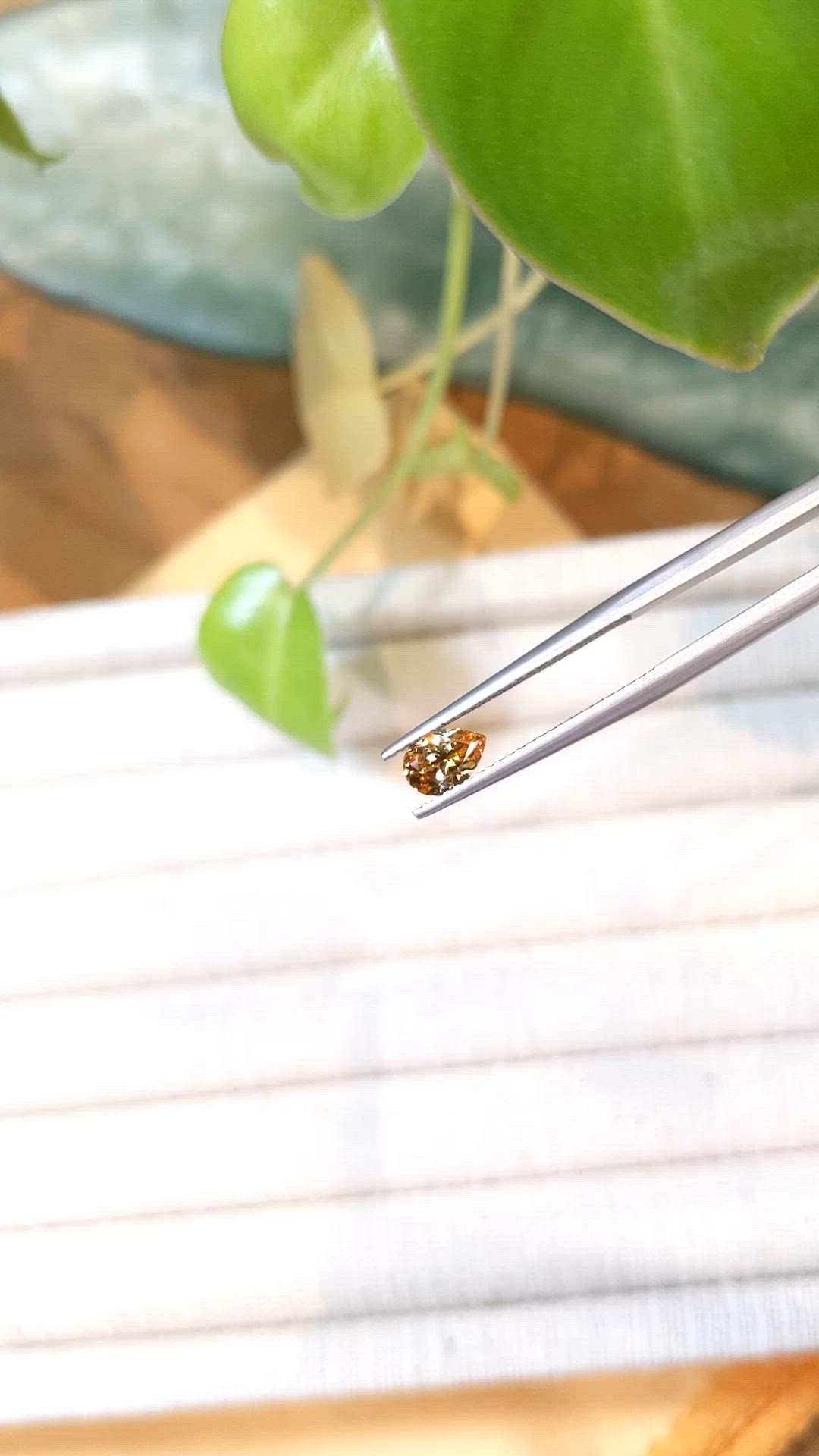 0.62 Ct. Orangish Yellow Sapphire from Montana Size Video