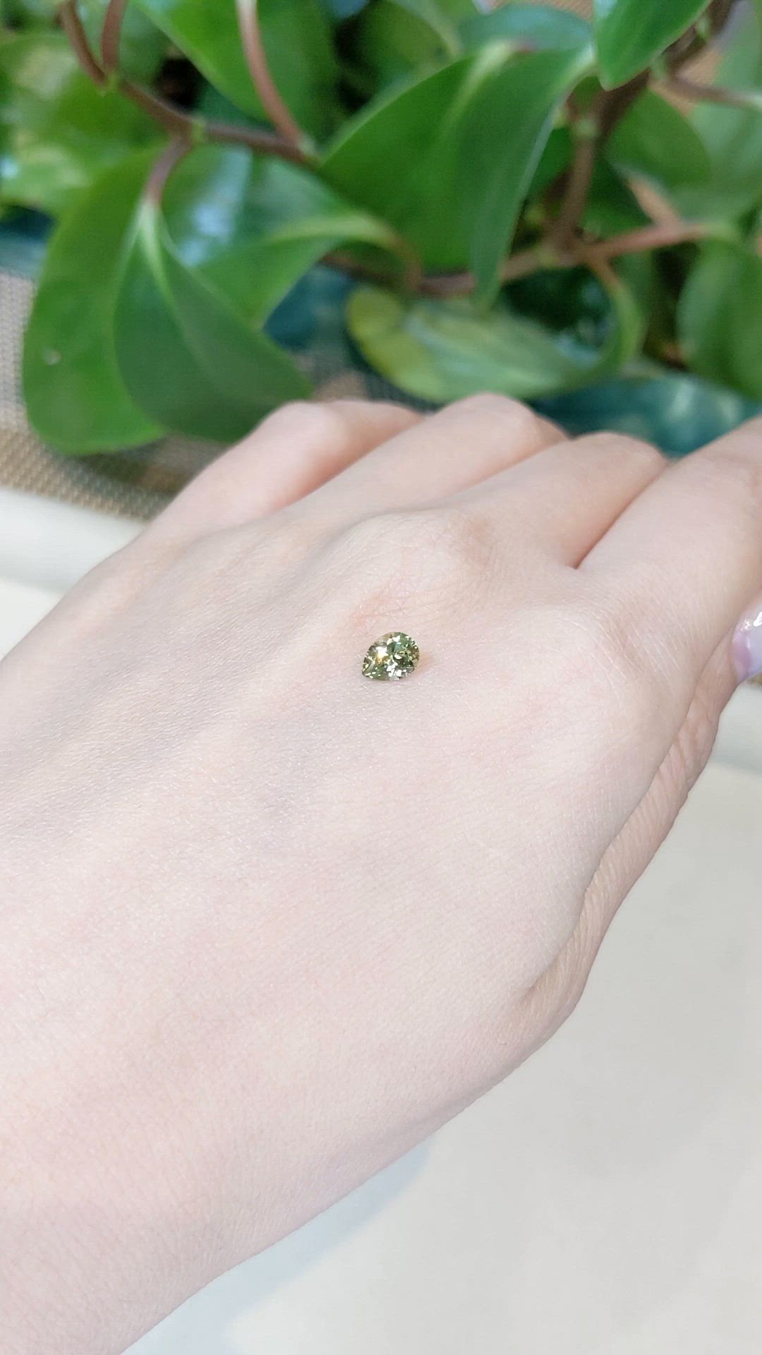 0.64 Ct. Greenish Yellow Sapphire from Montana Size Video