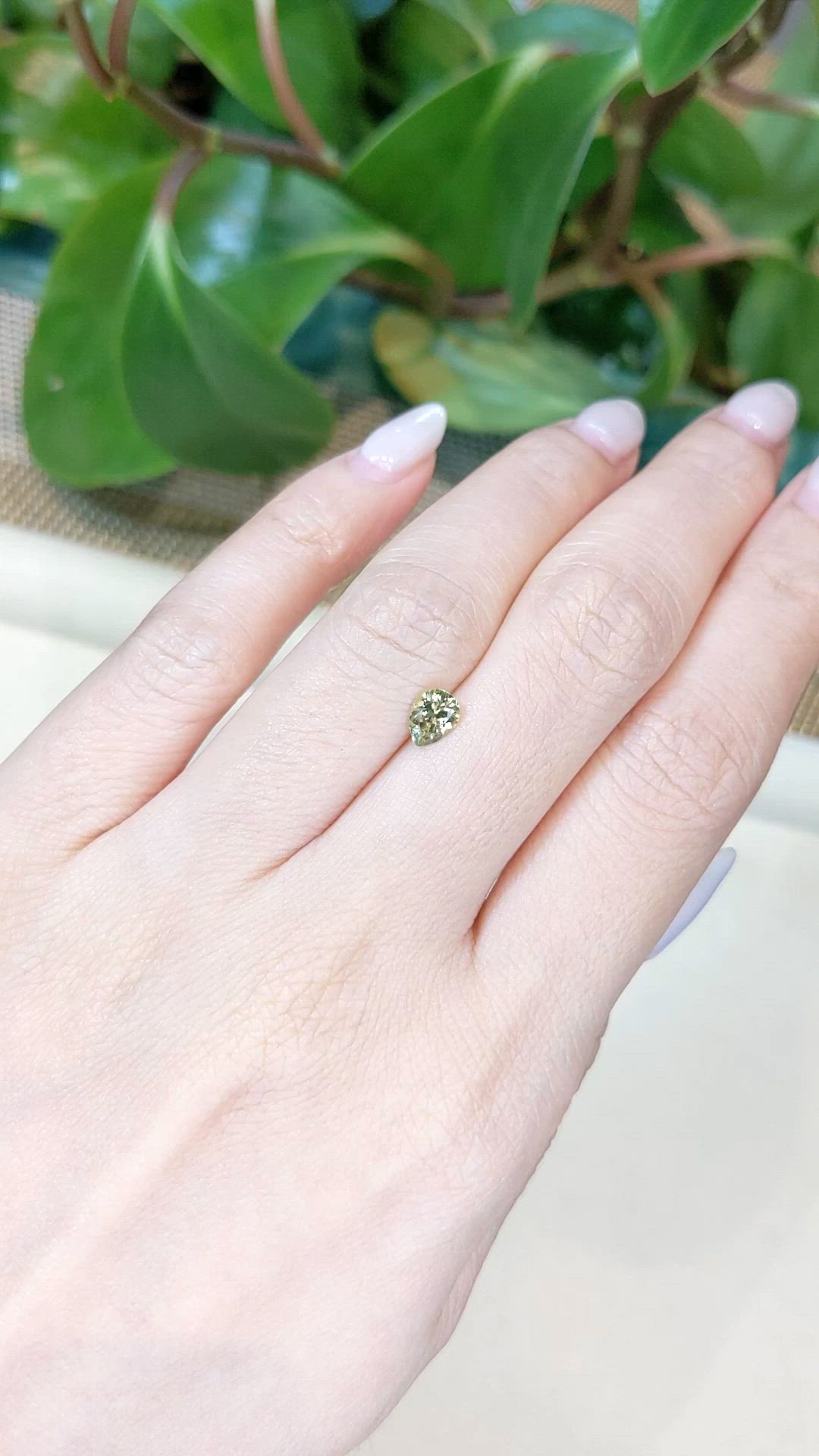 0.64 Ct. Greenish Yellow Sapphire from Montana Size Video