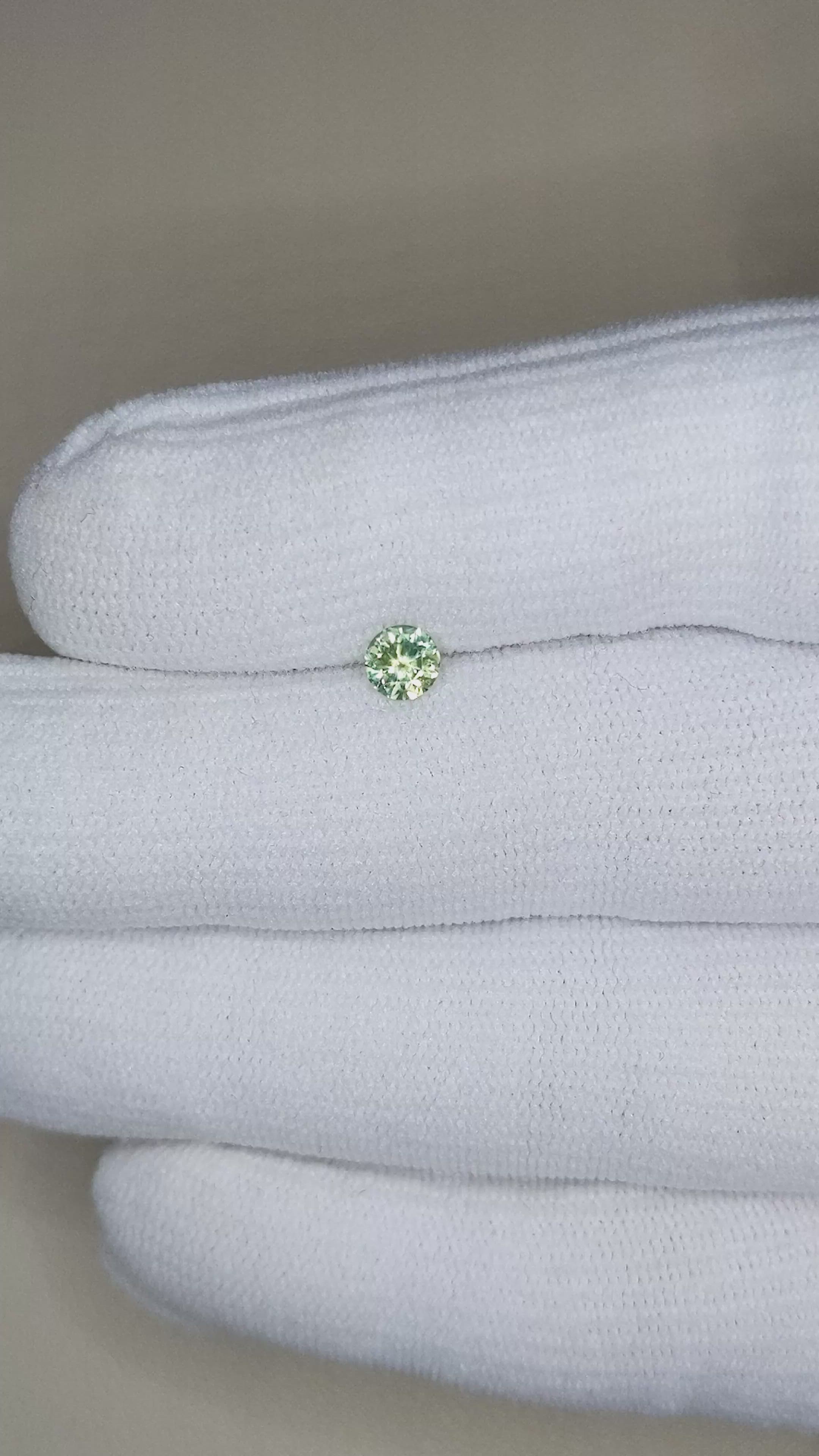 0.46 Ct. Yellowish Green Sapphire from Montana Size Video