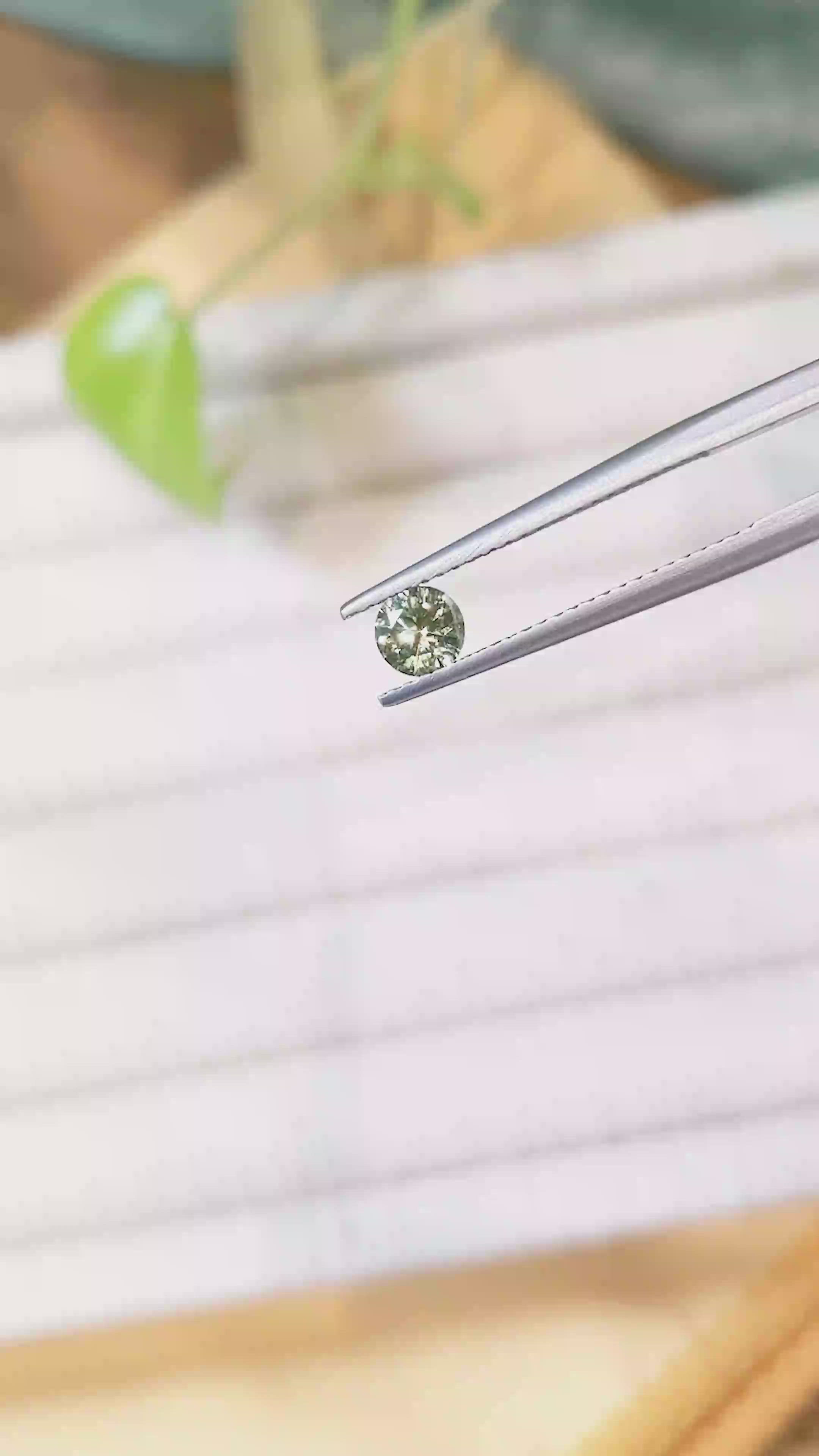 0.46 Ct. Yellowish Green Sapphire from Montana Size Video