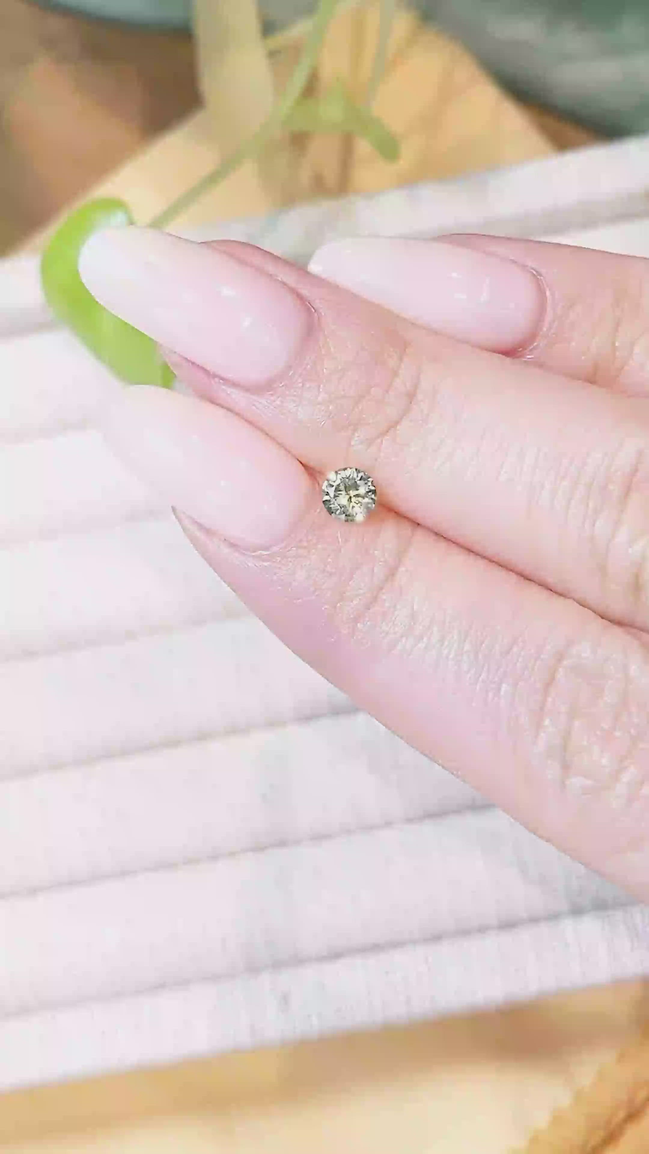 0.46 Ct. Yellowish Green Sapphire from Montana Size Video