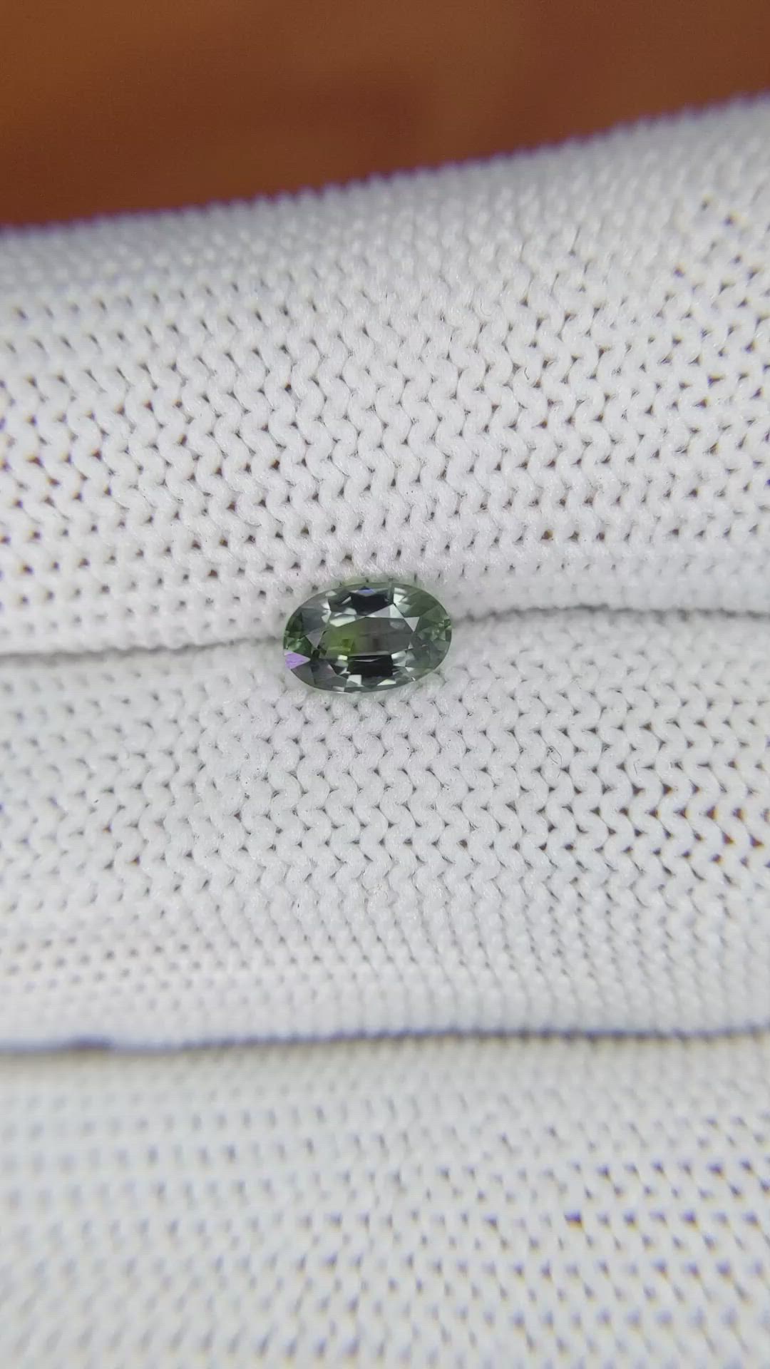 0.70 Ct. Brownish Green Sapphire from Madagascar Size Video