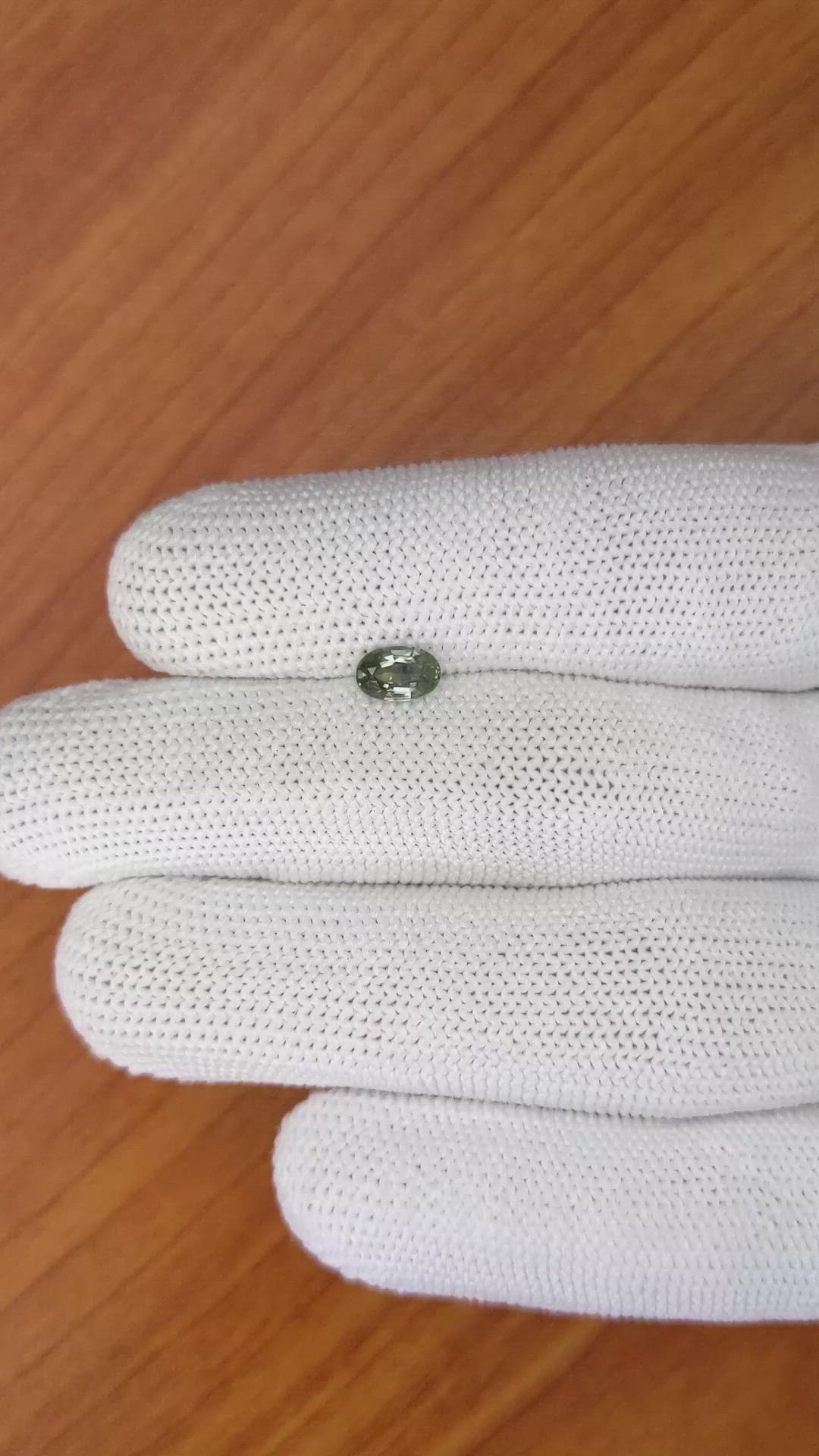 0.70 Ct. Brownish Green Sapphire from Madagascar Size Video