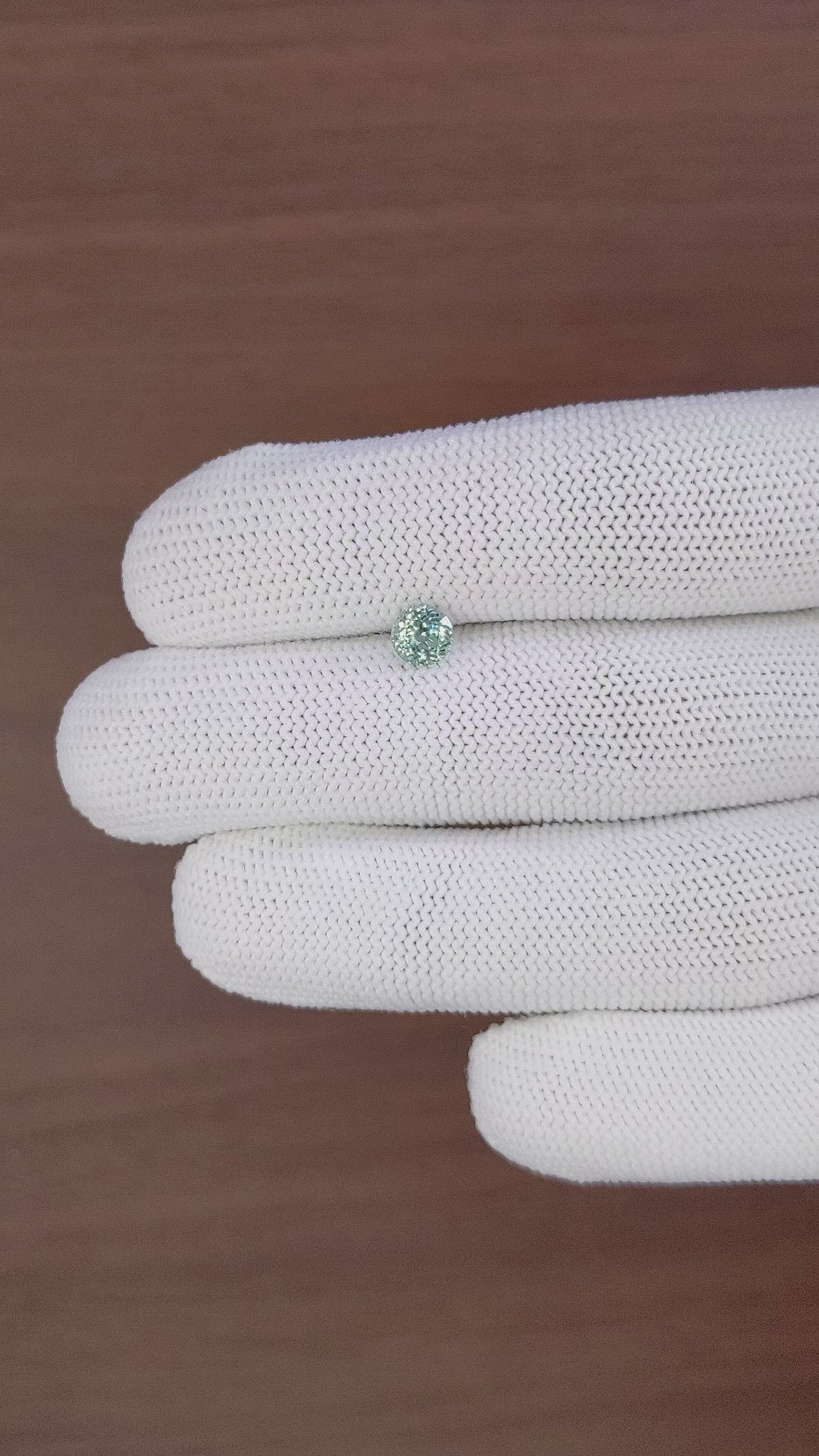 0.75 Ct. Bluish Green Sapphire from Montana Size Video
