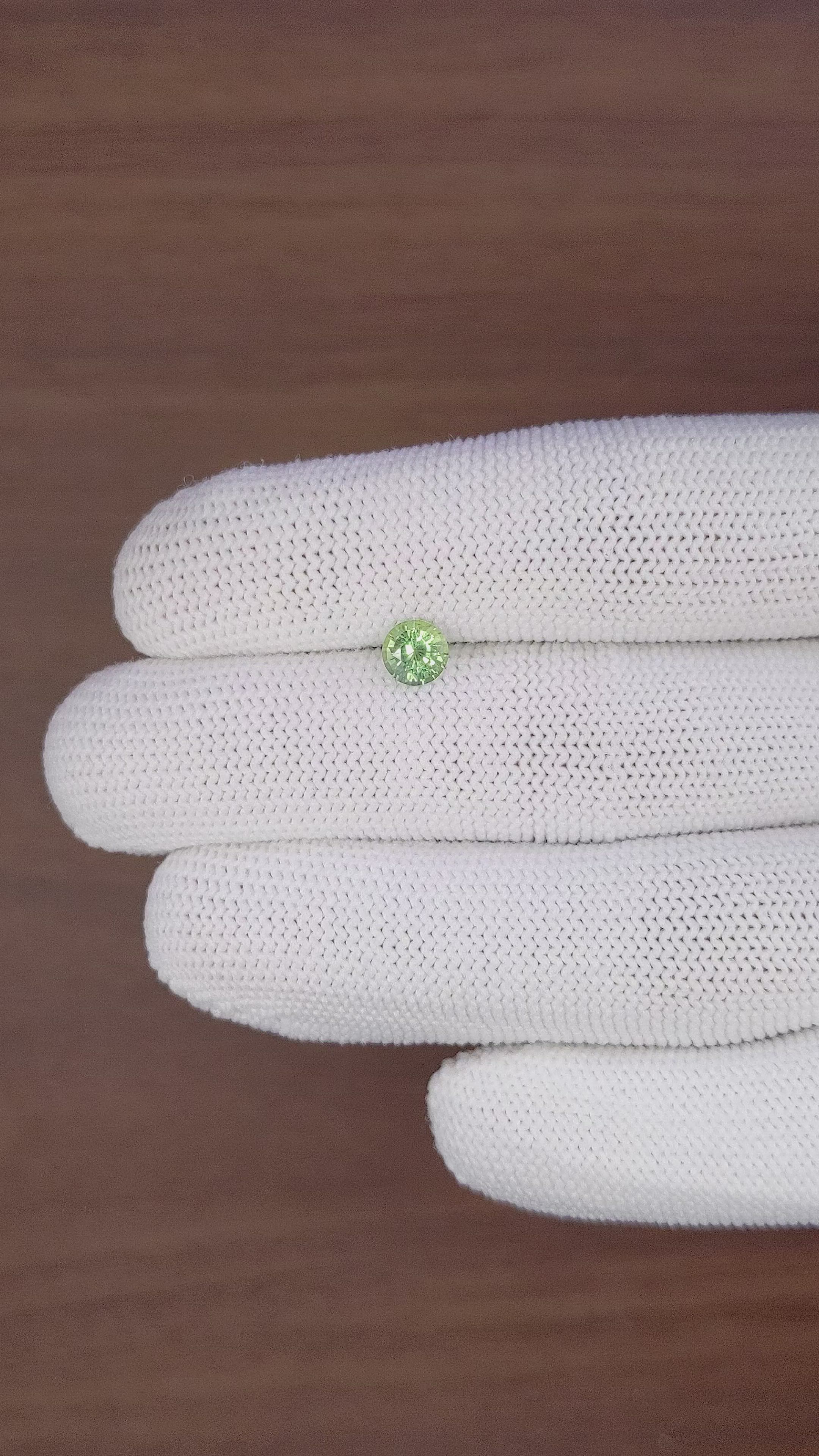 0.92 Ct. Yellowish Green Sapphire from Madagascar Size Video