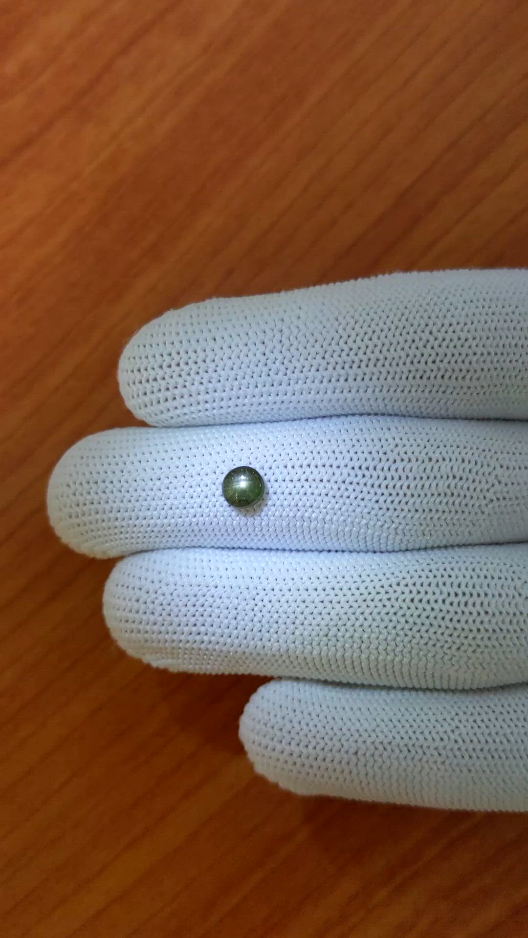 0.75 Ct. Brownish Green Star Sapphire from Ceylon (Sri Lanka) Size Video