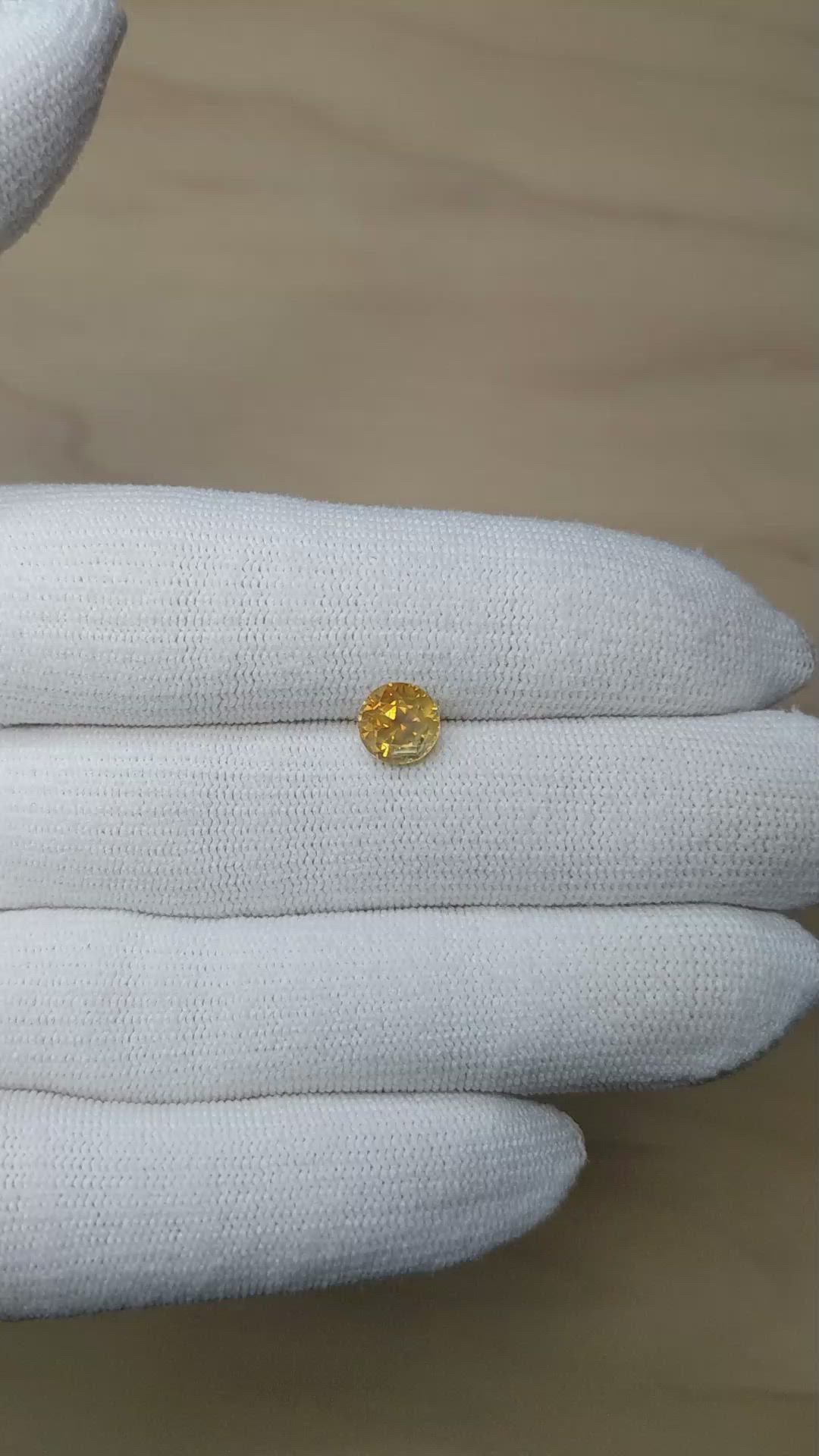1.95 Ct. Orangish Yellow Sapphire from Montana Size Video