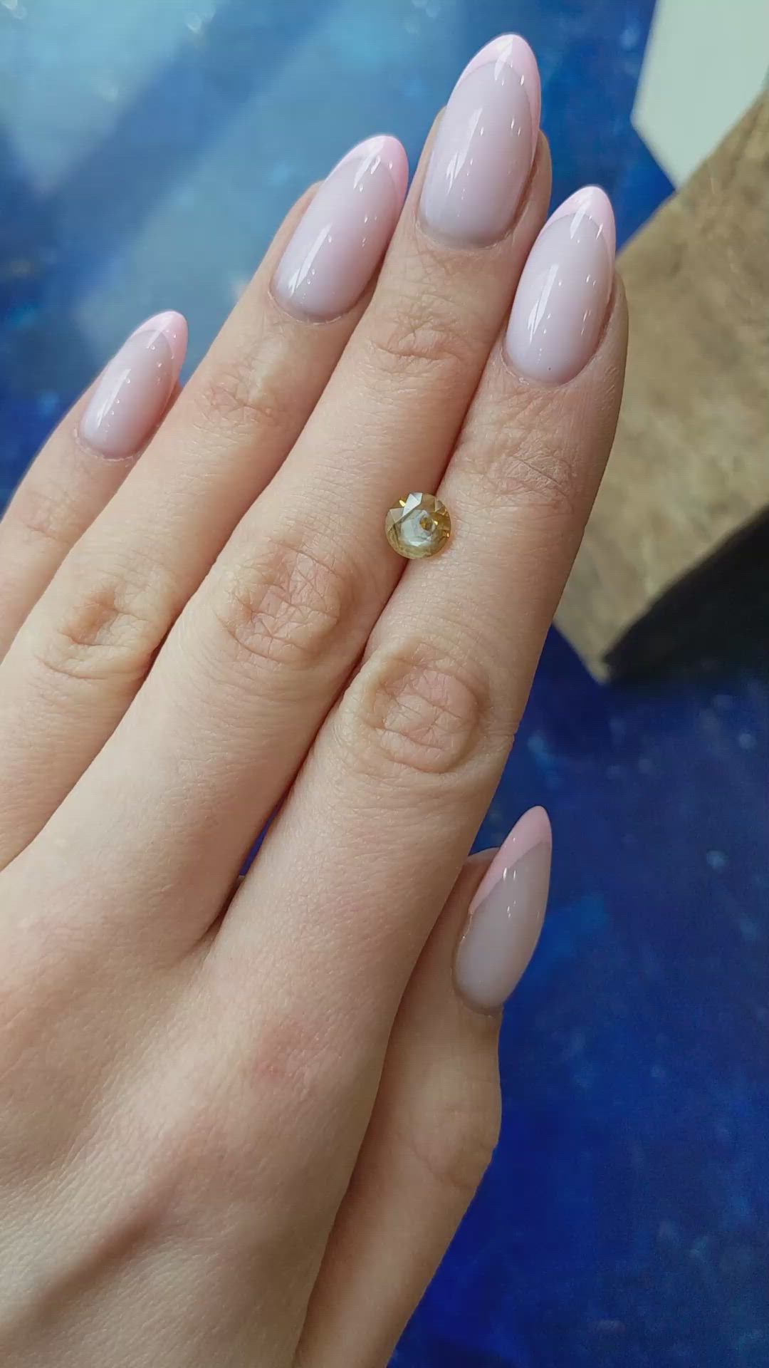 1.95 Ct. Orangish Yellow Sapphire from Montana Size Video