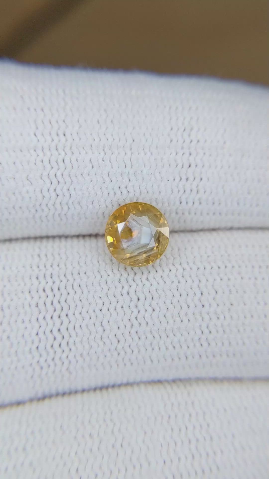 1.95 Ct. Orangish Yellow Sapphire from Montana Size Video
