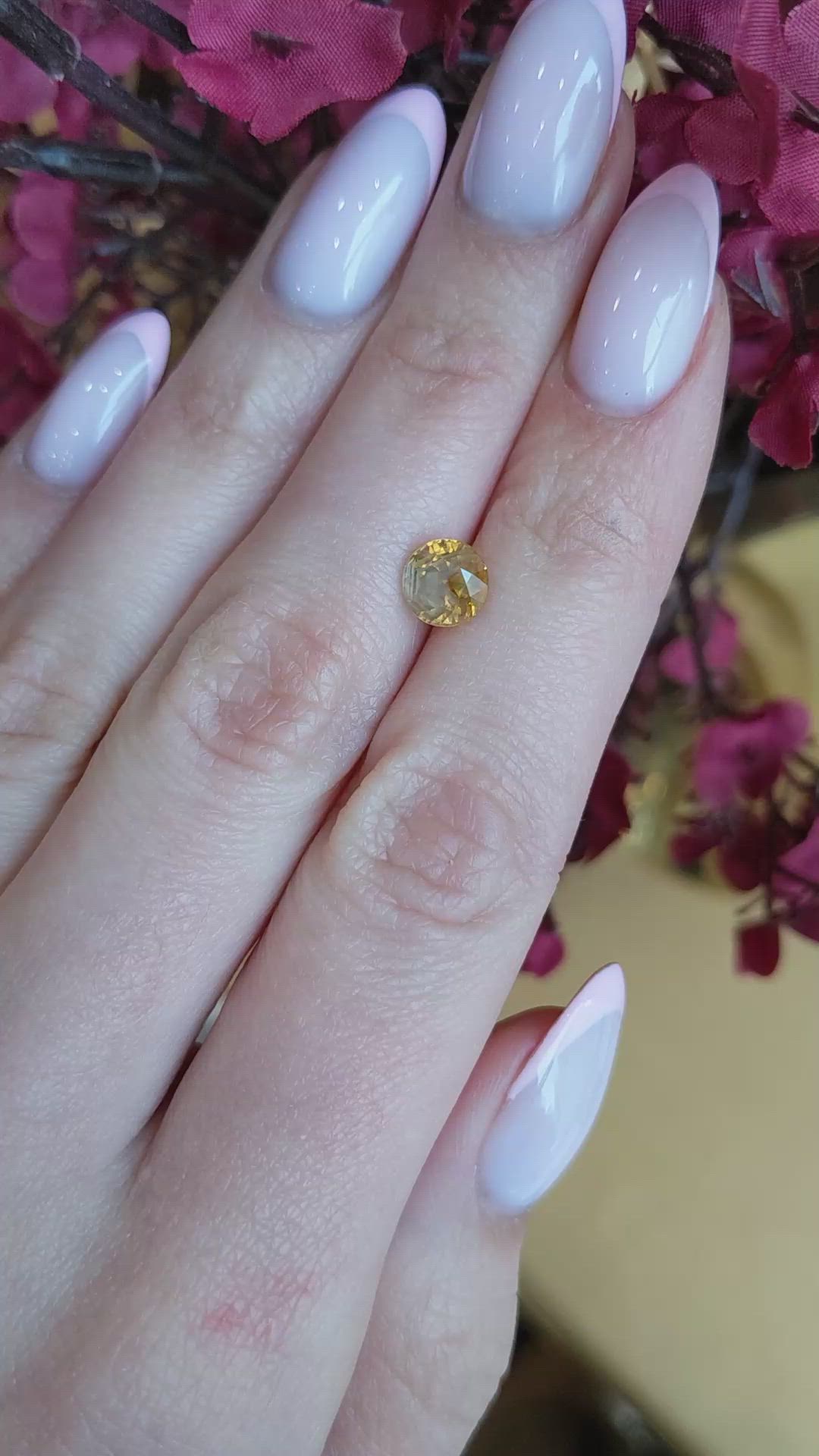 1.95 Ct. Orangish Yellow Sapphire from Montana Size Video
