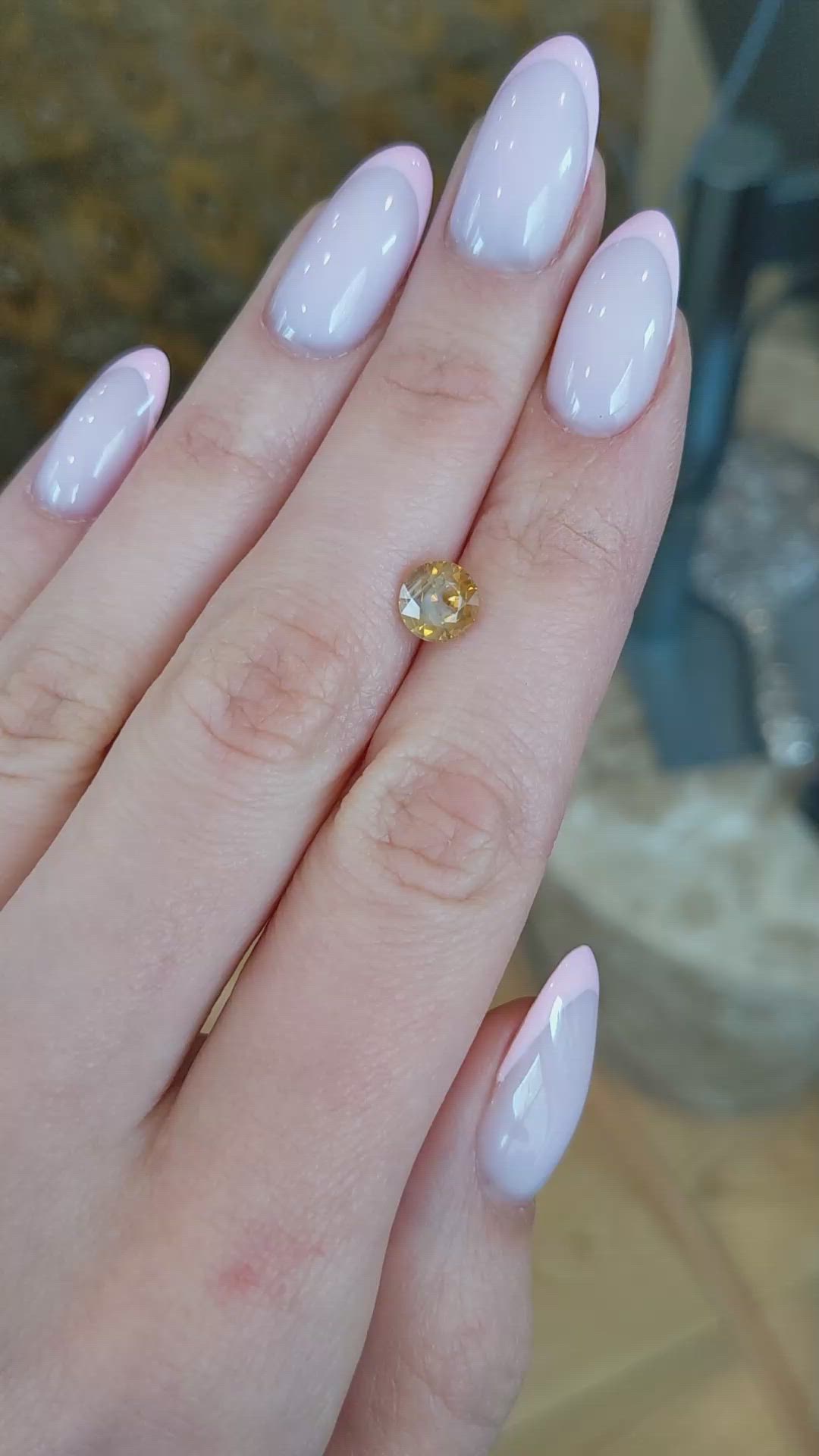 1.95 Ct. Orangish Yellow Sapphire from Montana Size Video