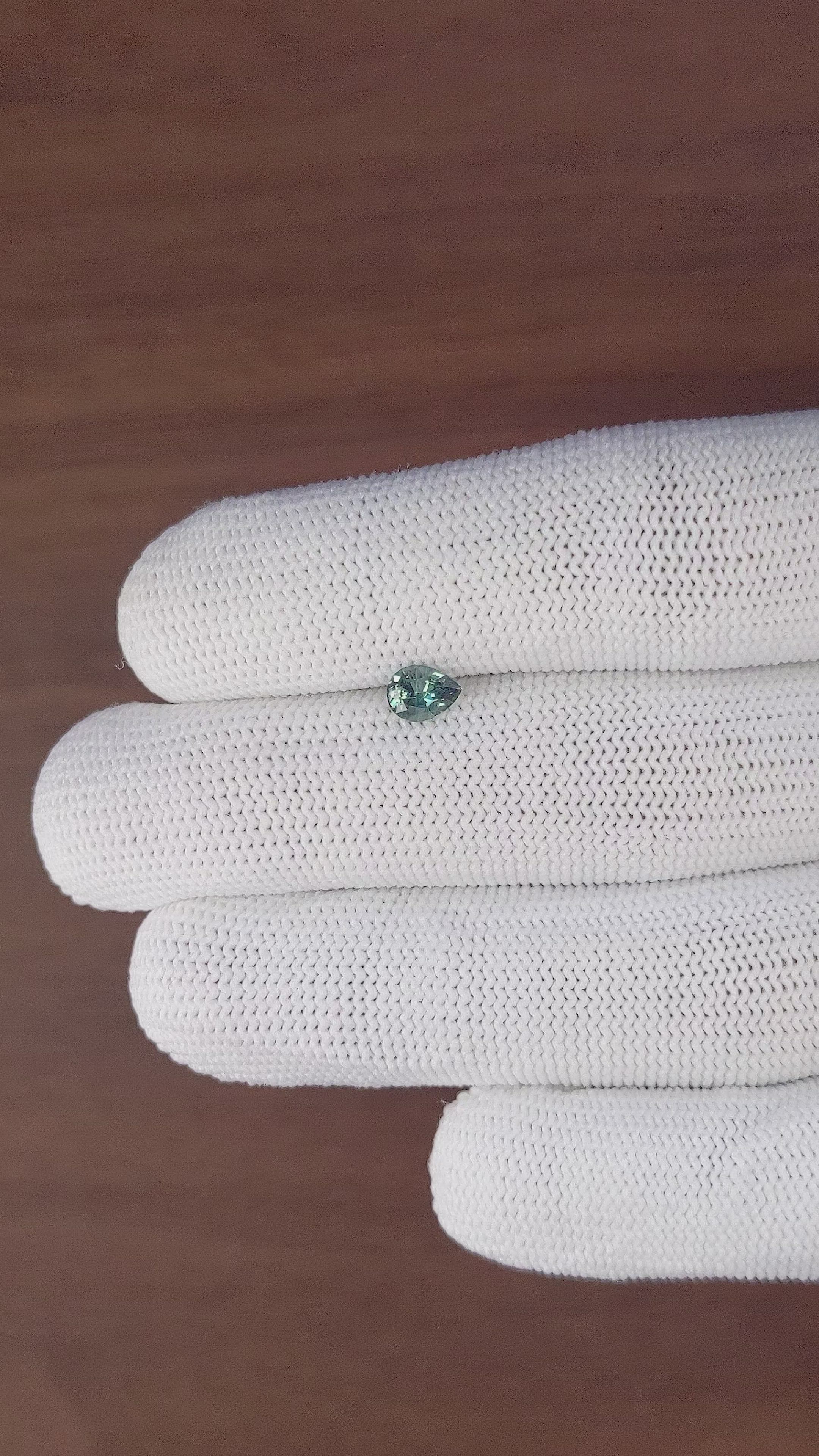 0.69 Ct. Bluish Green Sapphire from Madagascar Size Video
