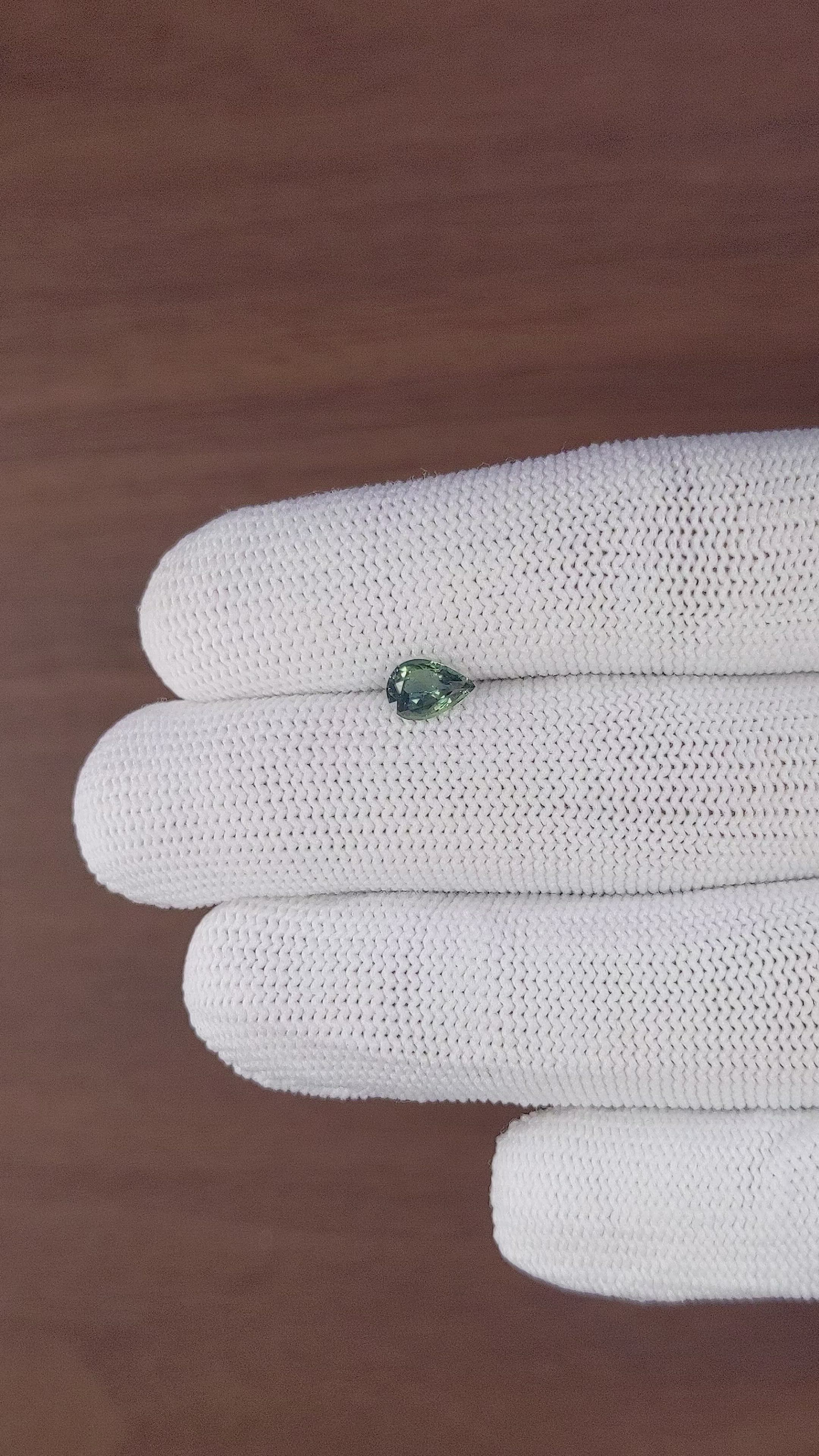 0.74 Ct. Bluish Green Sapphire from Madagascar Size Video