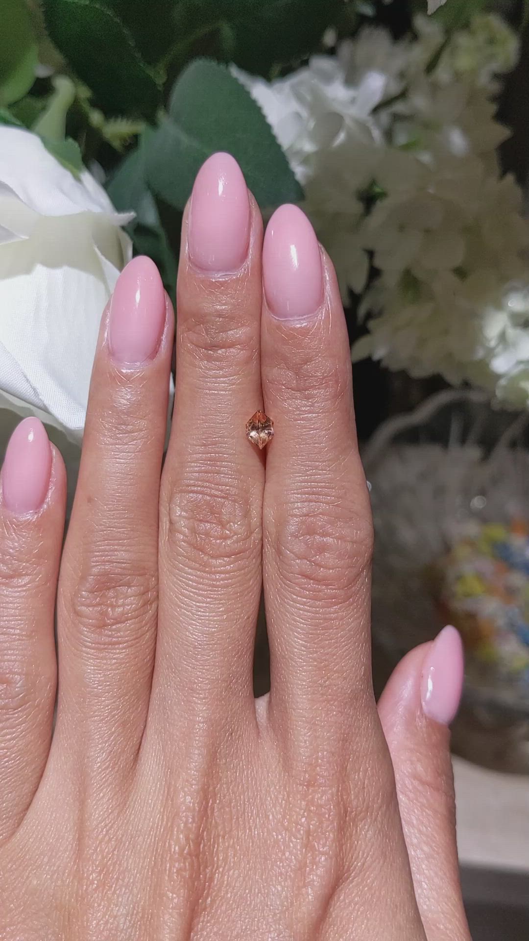 0.54 Ct. Peach Sapphire from Ceylon (Sri Lanka) Size Video