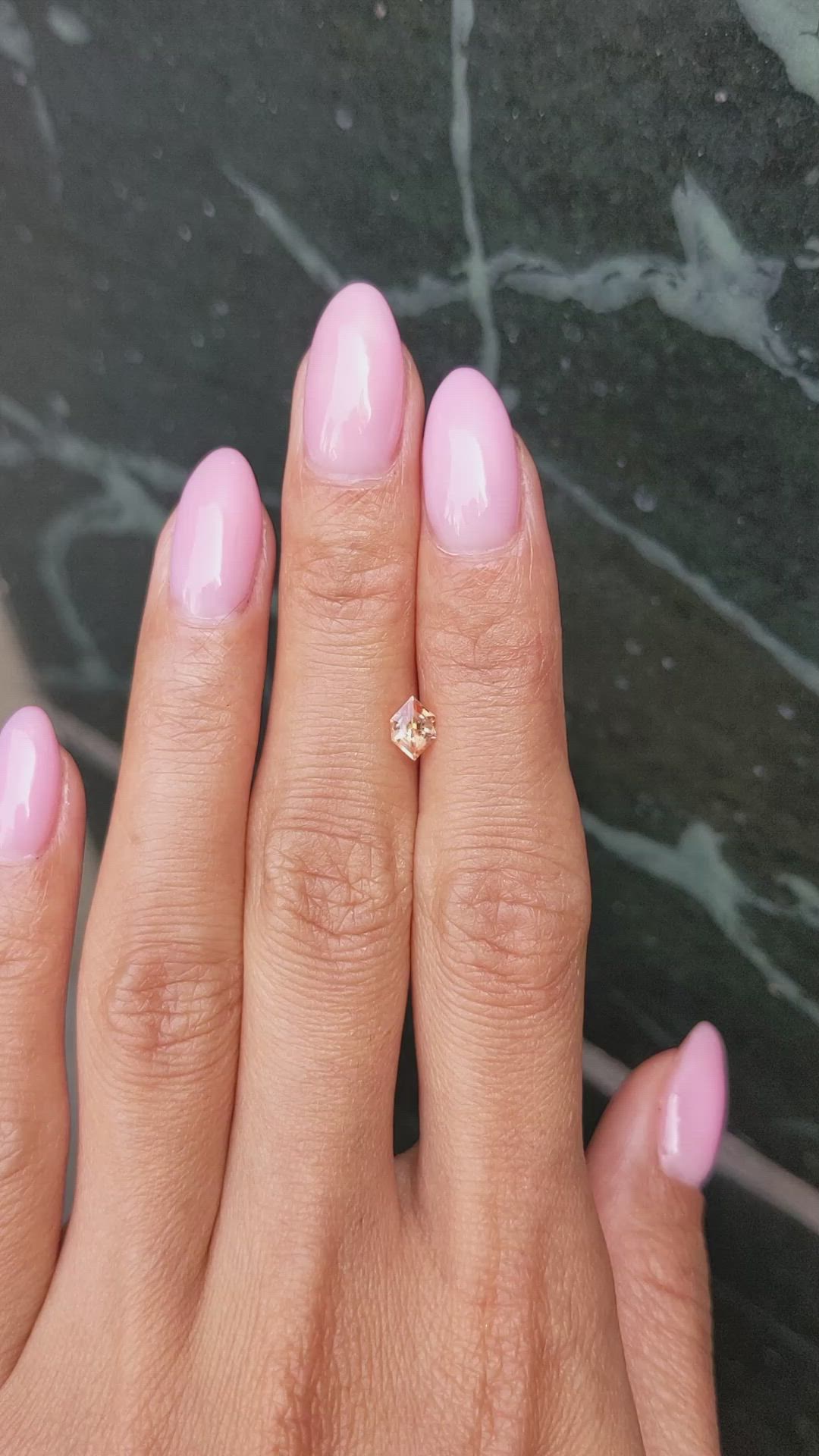 0.54 Ct. Peach Sapphire from Ceylon (Sri Lanka) Size Video