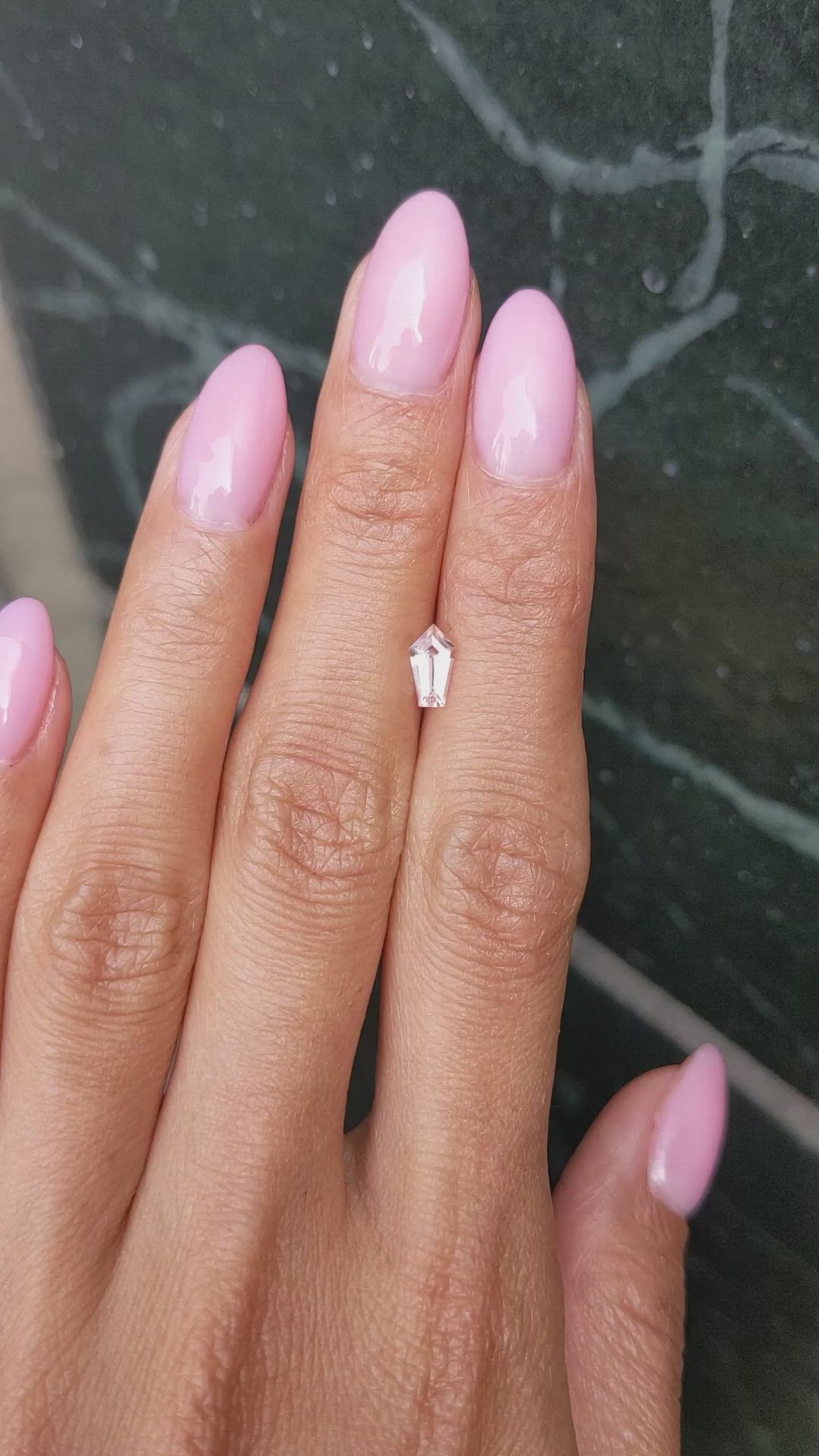 0.59 Ct. Peach Sapphire from Ceylon (Sri Lanka) Size Video