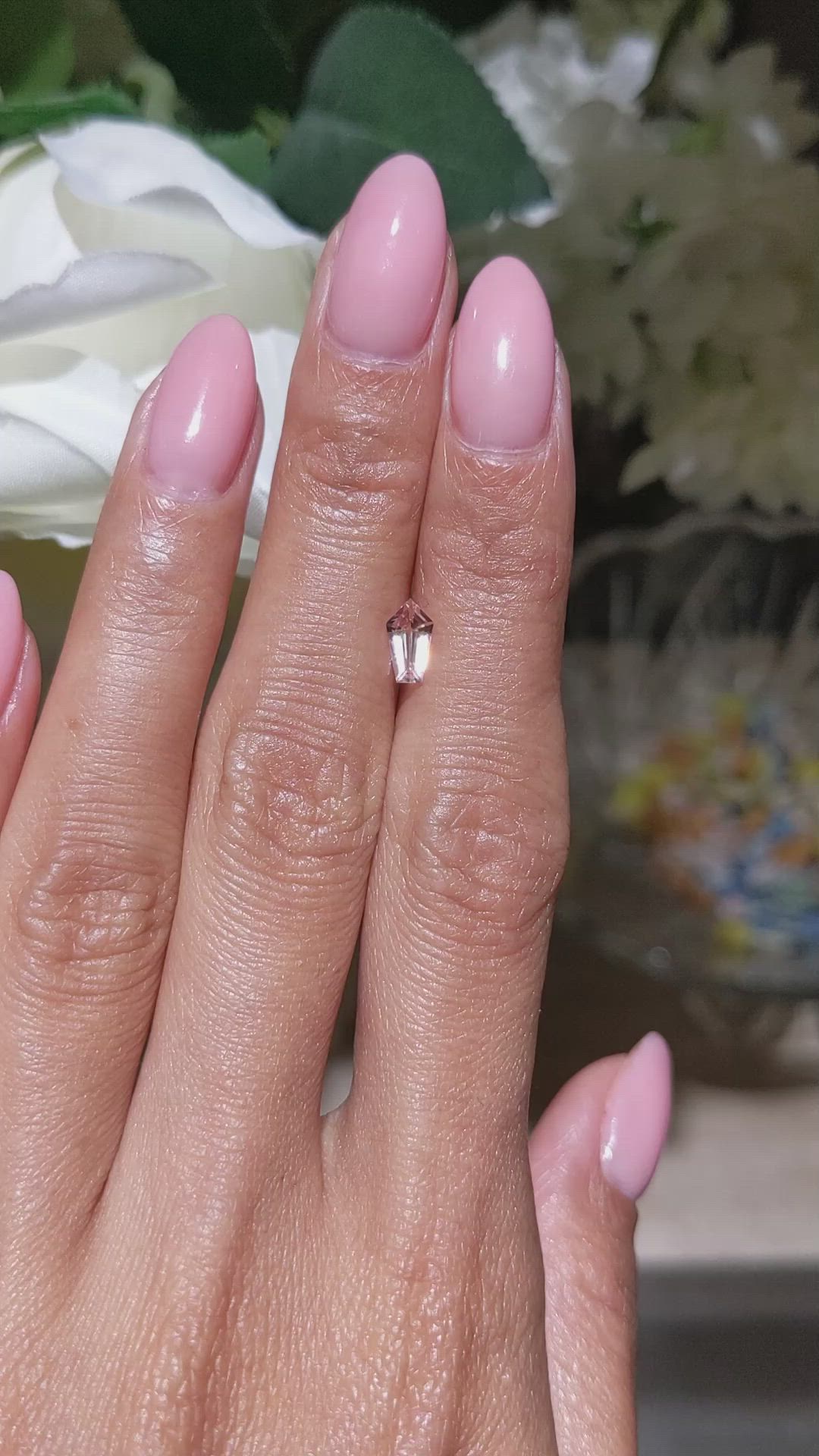 0.59 Ct. Peach Sapphire from Ceylon (Sri Lanka) Size Video