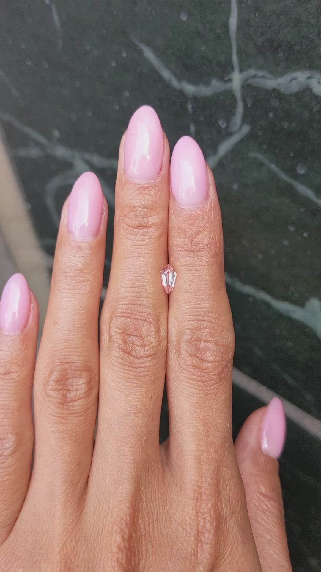 0.60 Ct. Peach Sapphire from Ceylon (Sri Lanka) Size Video