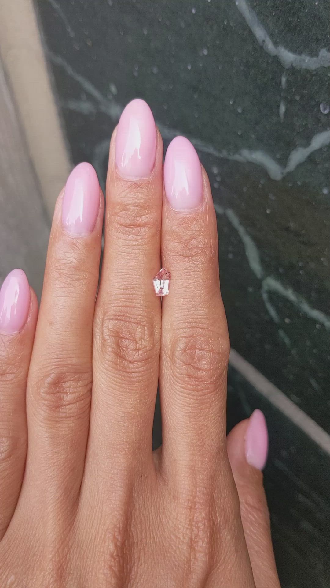 0.61 Ct. Peach Sapphire from Ceylon (Sri Lanka) Size Video