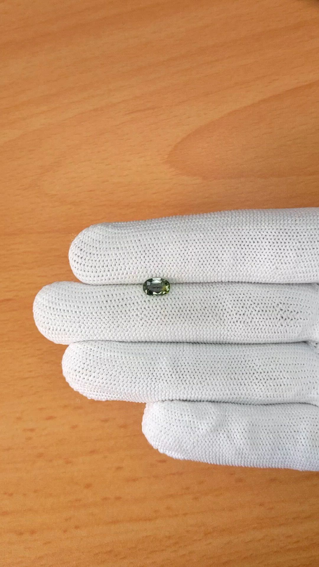 0.76 Ct. Yellowish Green Sapphire from Ceylon (Sri Lanka) Size Video