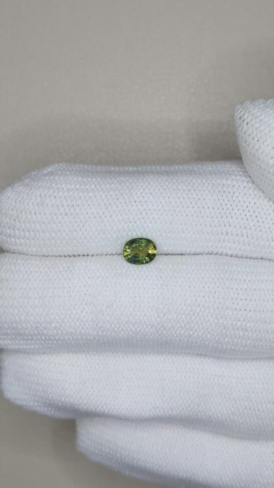 0.61 Ct. Yellowish Green Sapphire from Thailand Size Video