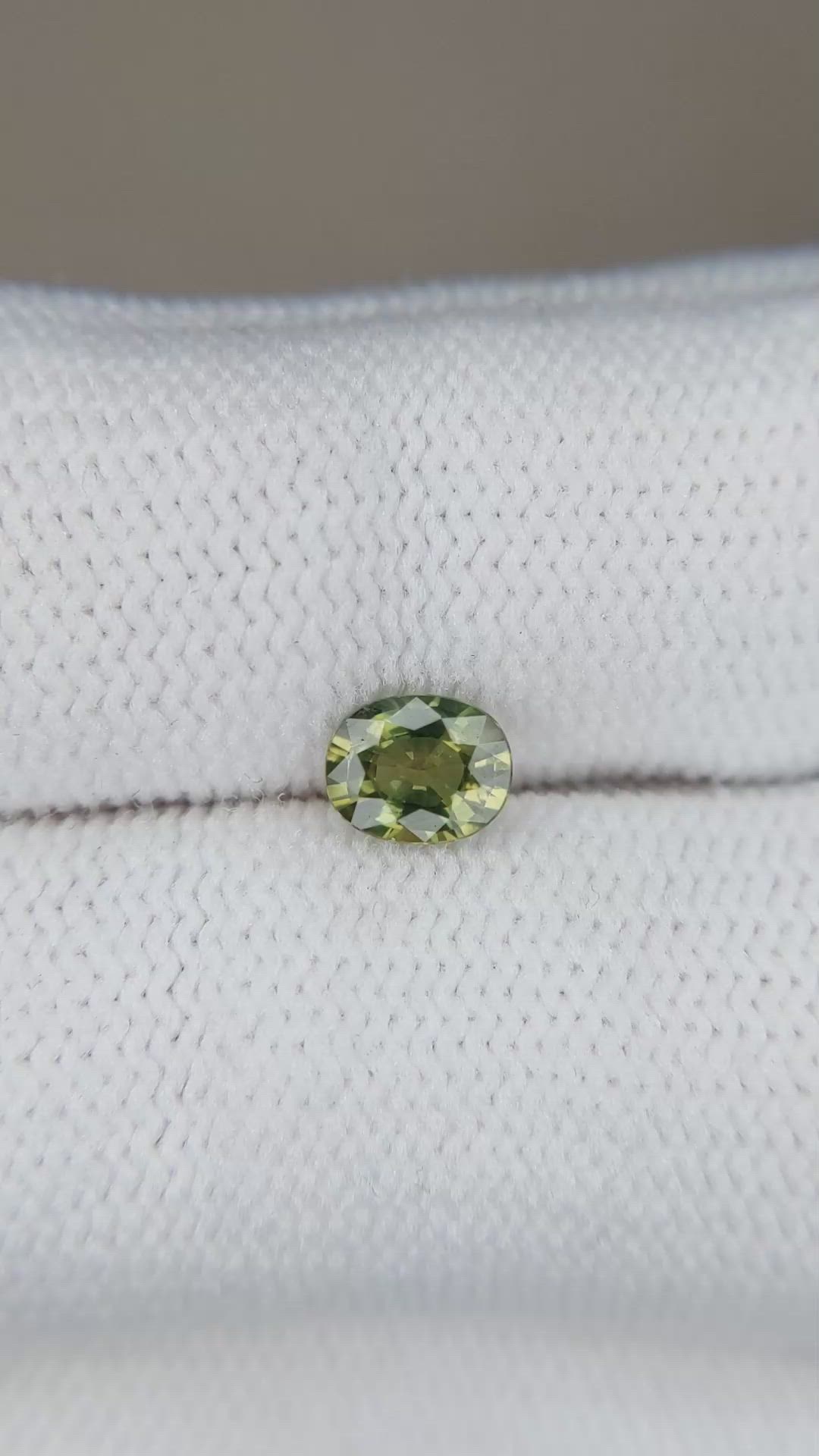 0.61 Ct. Yellowish Green Sapphire from Thailand Size Video