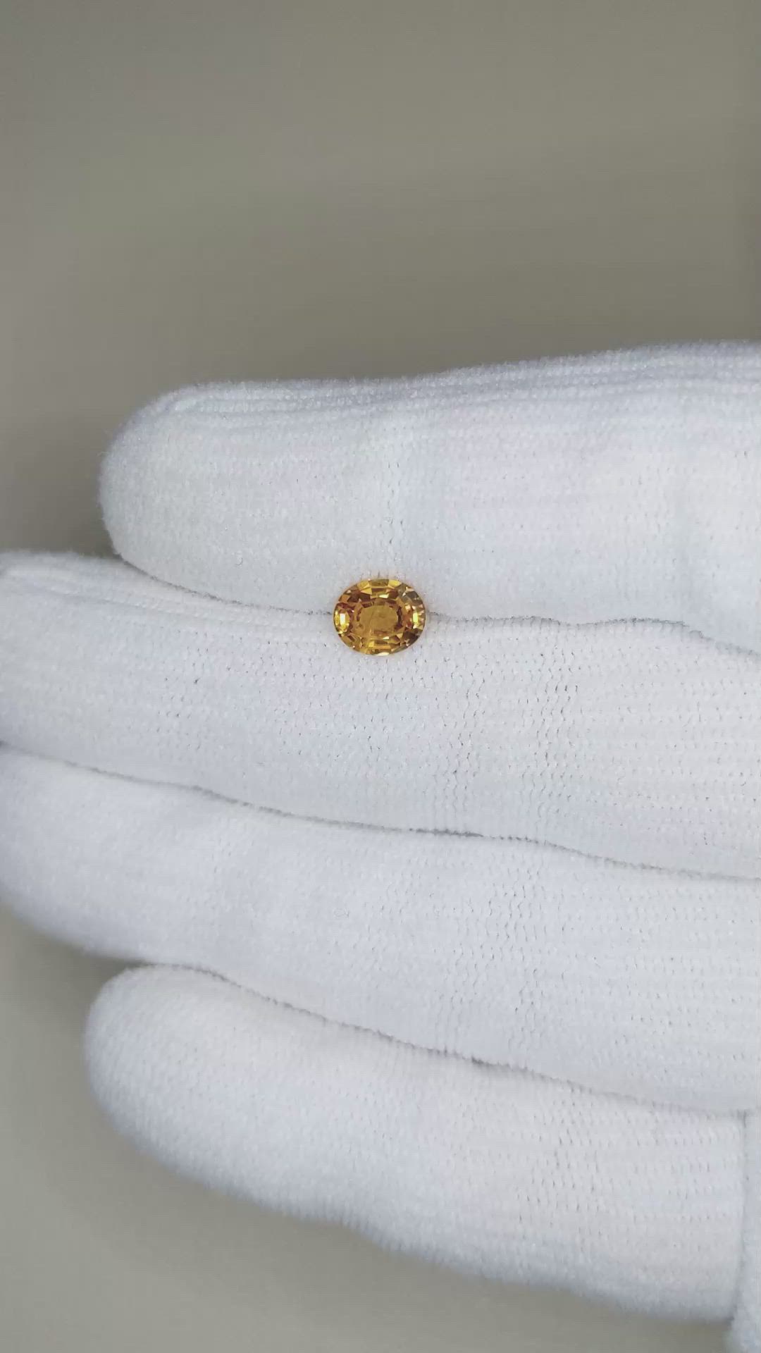 0.97 Ct. Orangish Yellow Sapphire from Thailand Size Video
