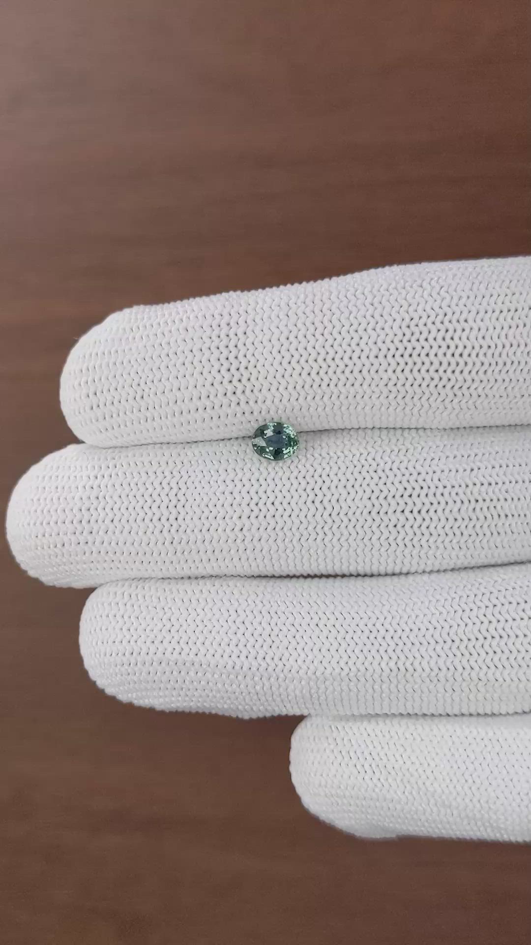 0.68 Ct. Bluish Green Sapphire from Tanzania Size Video