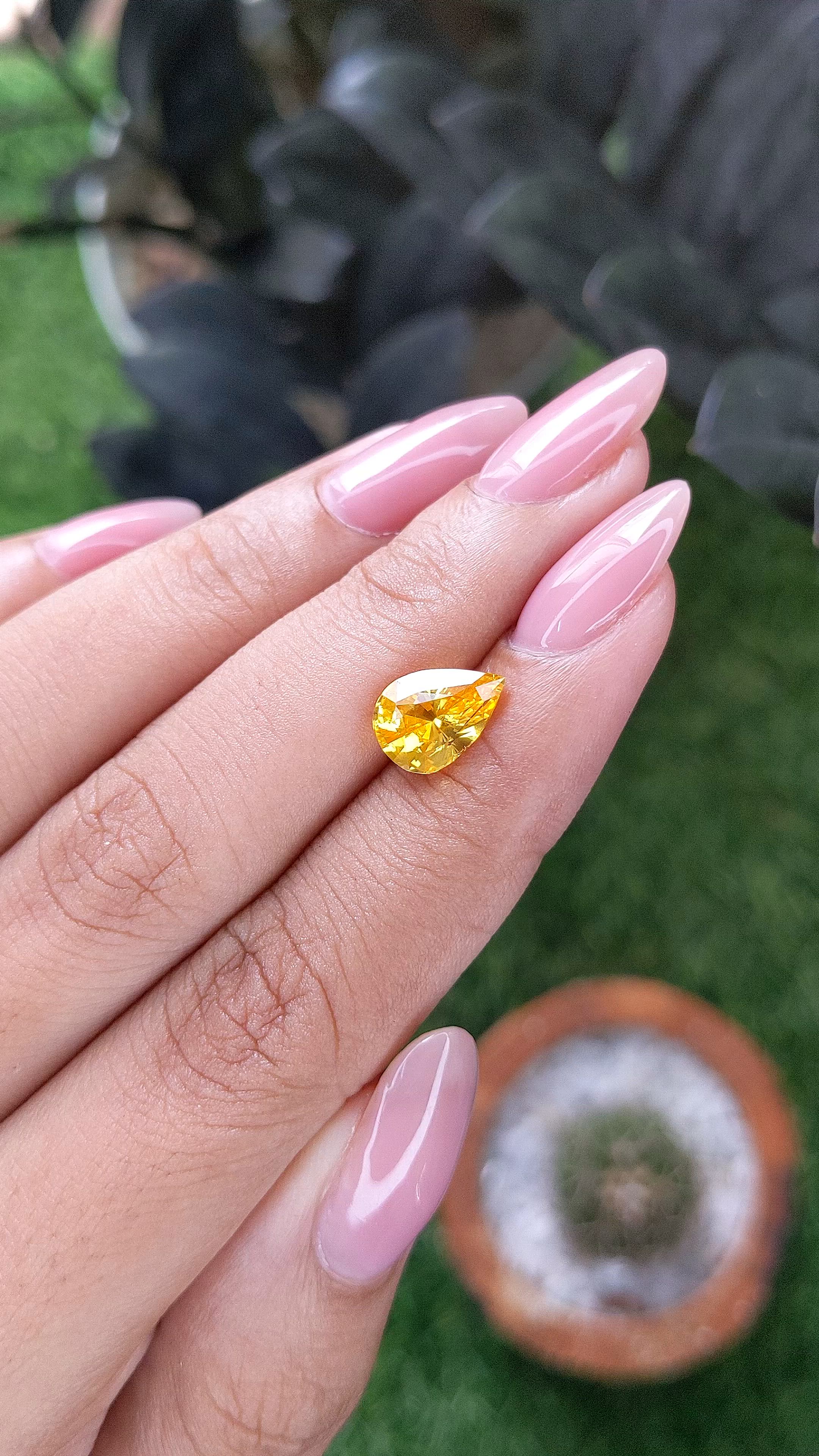2.57 Ct. Orangish Yellow Sapphire from Ceylon (Sri Lanka) Size Video